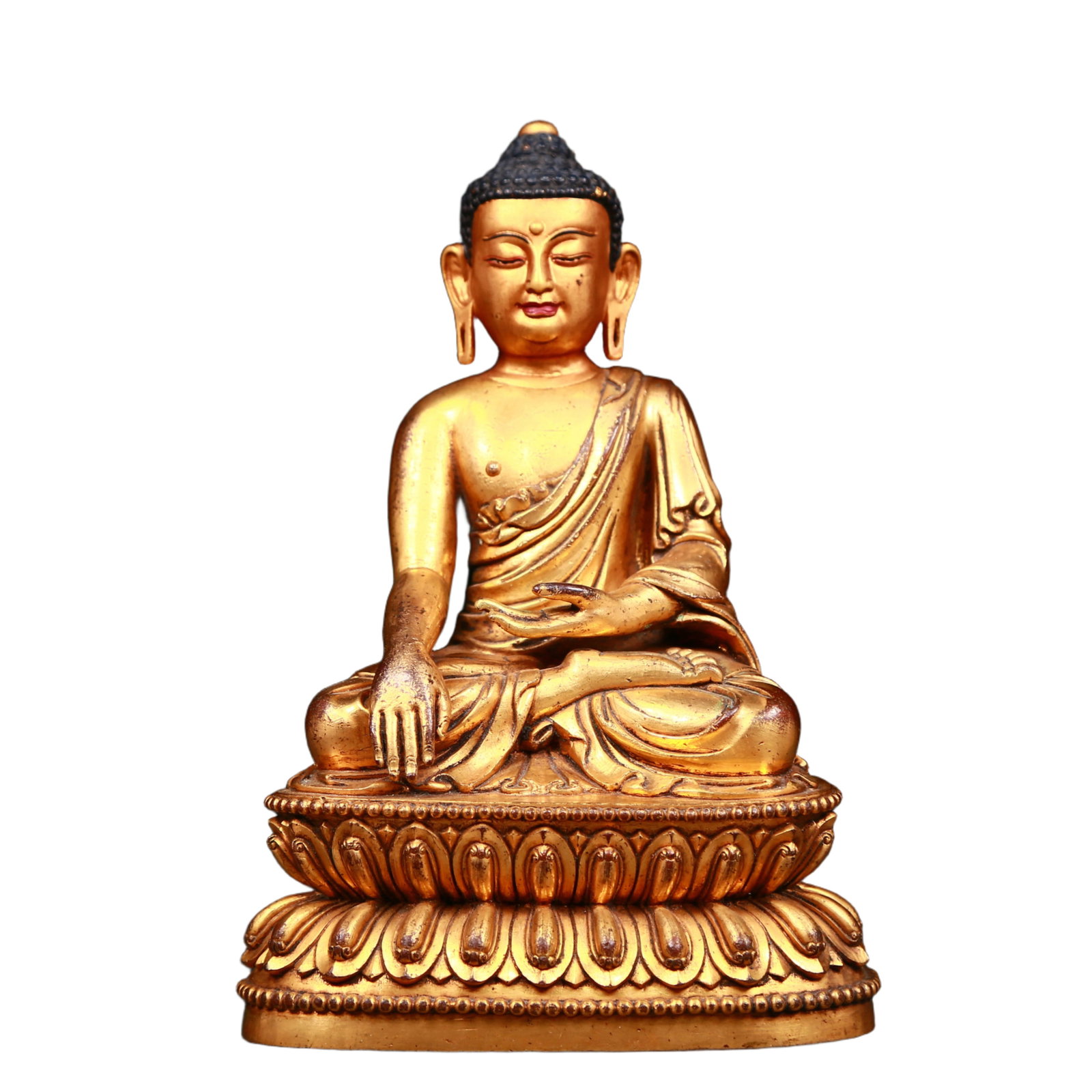 An exquisite gilt bronze statue of Sakyamuni: An exquisite gilt bronze statue of Sakyamuni, Qing Dynasty, China. The Buddha's face has a calm, kind and serene expression, and his hands and fingers show beautiful lines and proportions to demonstra