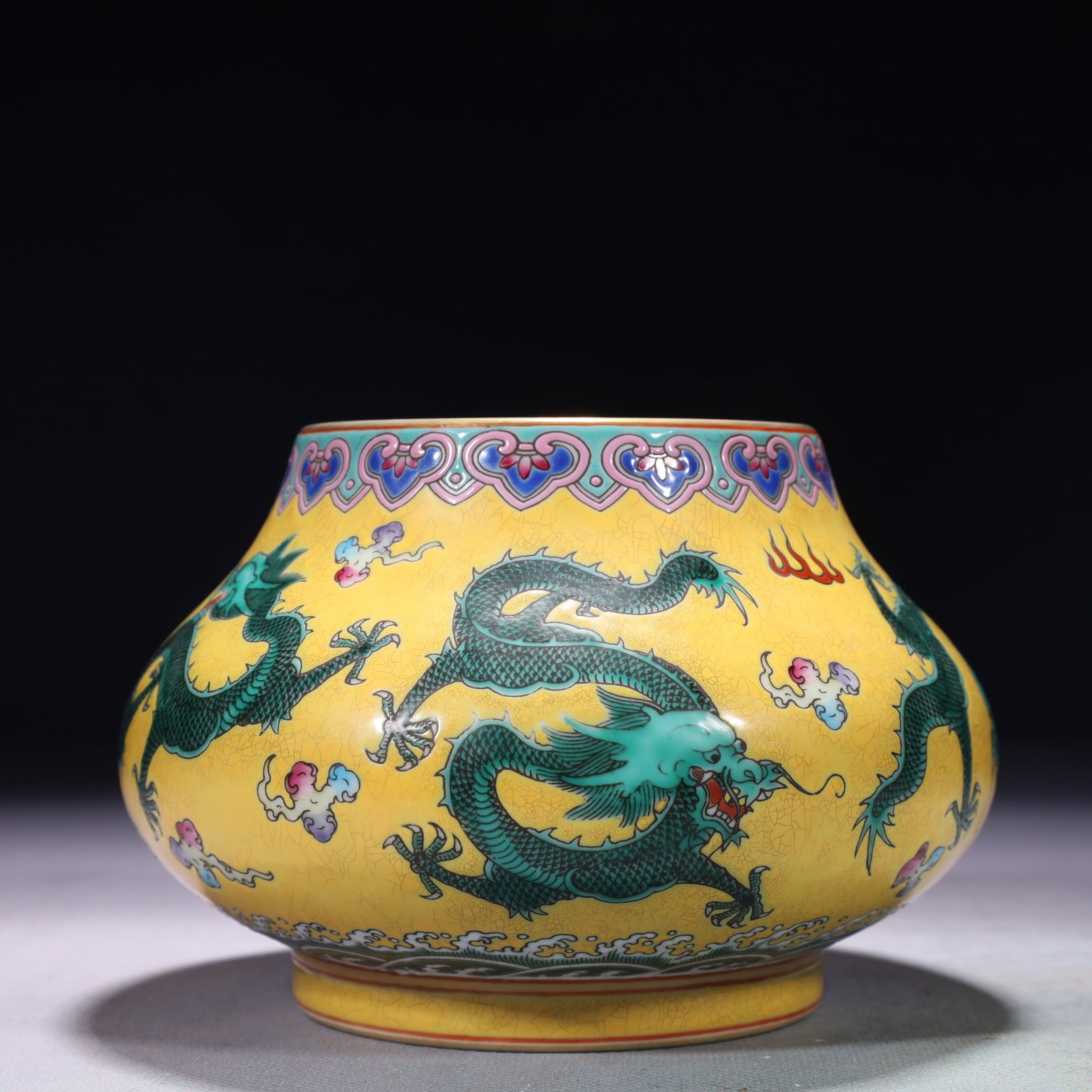 An Exquisite Yellow Ground Green Glazed Auspicious Cloud and Dragon Pattern Jar: An Exquisite Yellow Ground Green Glazed Auspicious Cloud and Dragon Pattern Jar,Qing Dynasty,China,Yongzheng Six-character Mark,Size:5.9inx4.3in,Weight:800g 黄地绿釉祥
