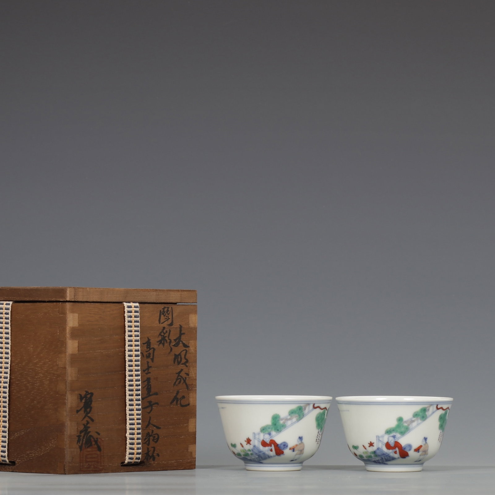 A Pair of Exquisite Doucai Character and Story Pattern Cups (1 of 9)