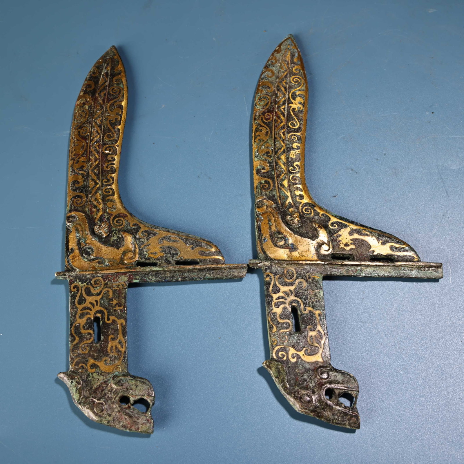 A Pair of Exquisite Bronze Inlaid Gold Ornaments: A Pair of Exquisite Bronze Inlaid Gold Ornaments,the Warring States period in China,Size:11inx4.3in,Weight:400g 一对青铜错金摆件,中国战