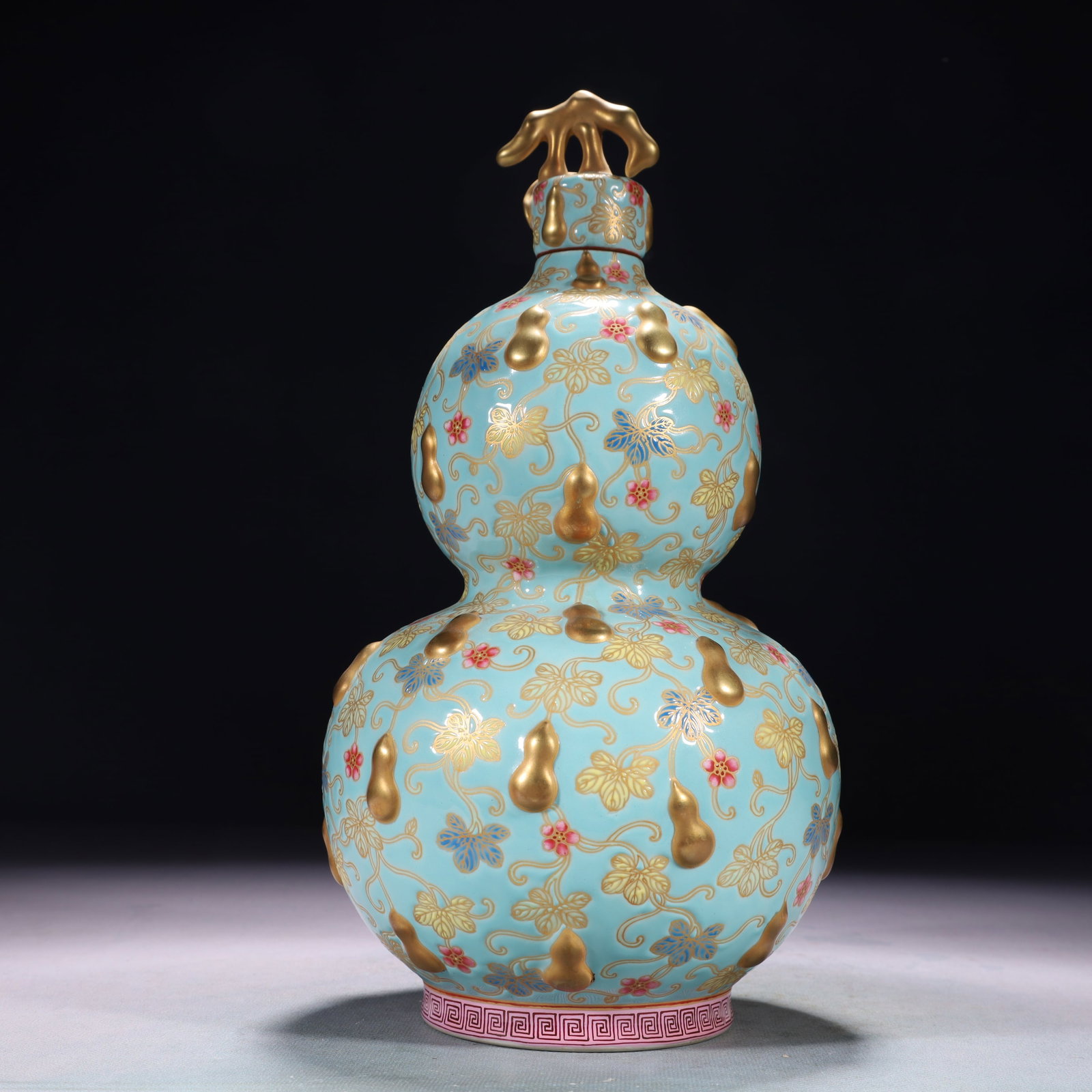 An Exquisite Turquoise Glazed Enamel Painted Gold Gourd Pattern Gourd-Shaped Vase: An Exquisite Turquoise Glazed Enamel Painted Gold Gourd Pattern Gourd-Shaped Vase,Qing Dynasty,China,Qianlong Four-character Mark,Size:5.5inx11in,Weight:1200g 松石绿釉珐&