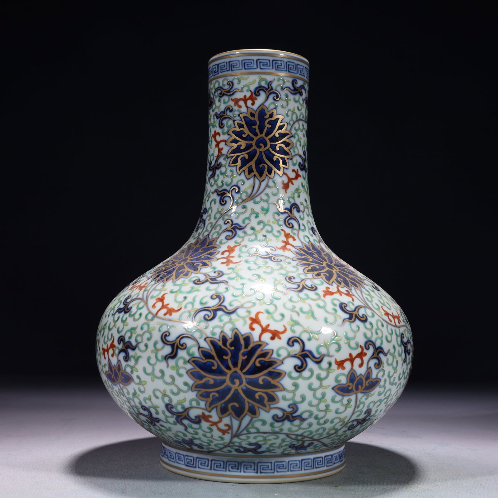 An Exquisite Blue and White Doucai Painted Gold Lotus Pattern Vase: An Exquisite Blue and White Doucai Painted Gold Lotus Pattern Vase,Qing Dynasty,China,Qianlong Six-character Mark,Size:7.9inx7.1in,Weight:2350g 青花斗彩描金缠