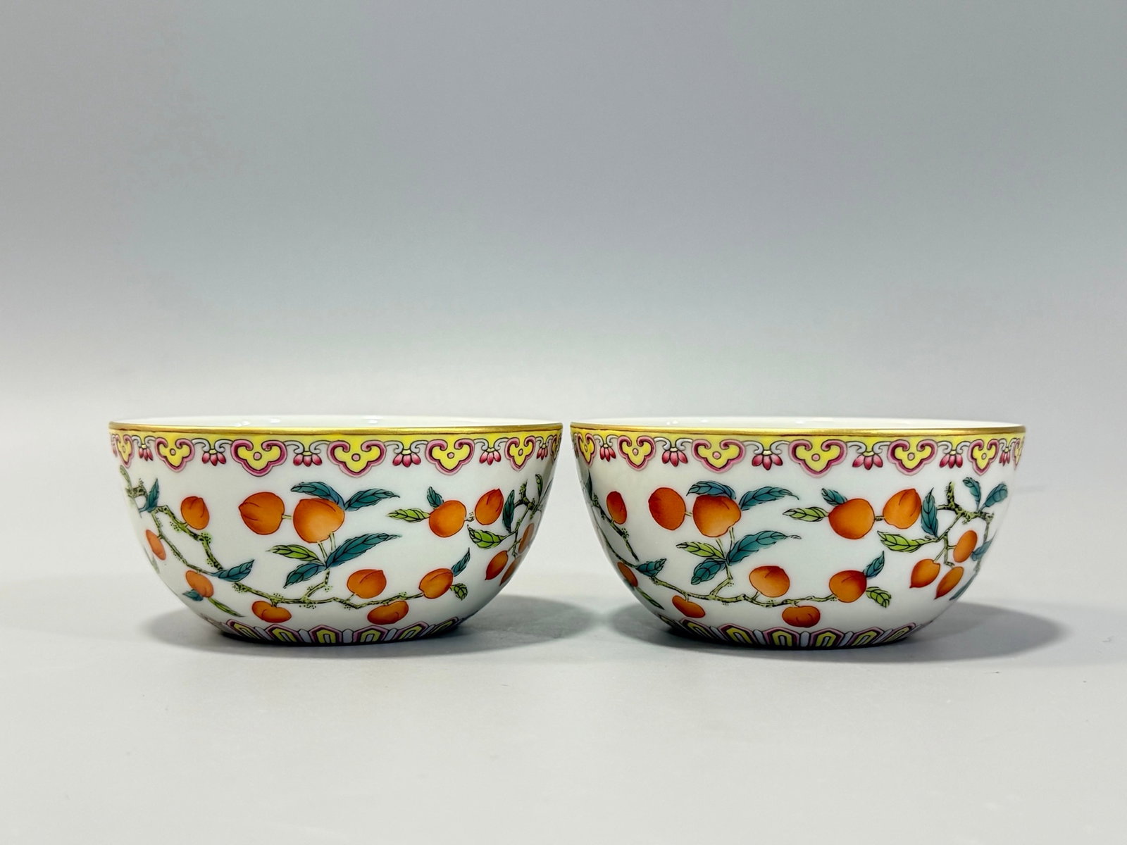 A Pair of Exquisite Famille-Rose Cherry Pattern Cups: A Pair of Exquisite Famille-Rose Cherry Pattern Cups,Qing Dynasty,China,Yongzheng Six-character Mark,Size:1.7inx3.7in 一对粉彩樱桃纹杯子,中&