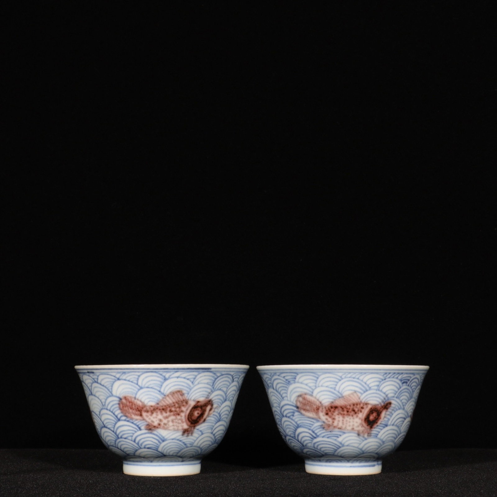 A Pair of Exquisite Blue and White Underglaze-Red Seawater and Fish Pattern Cups: A Pair of Exquisite Blue and White Underglaze-Red Seawater and Fish Pattern Cups,Ming Dynasty,China,Yongle Four-character Mark,Size:2inx3.3in 一对青花釉里红&#