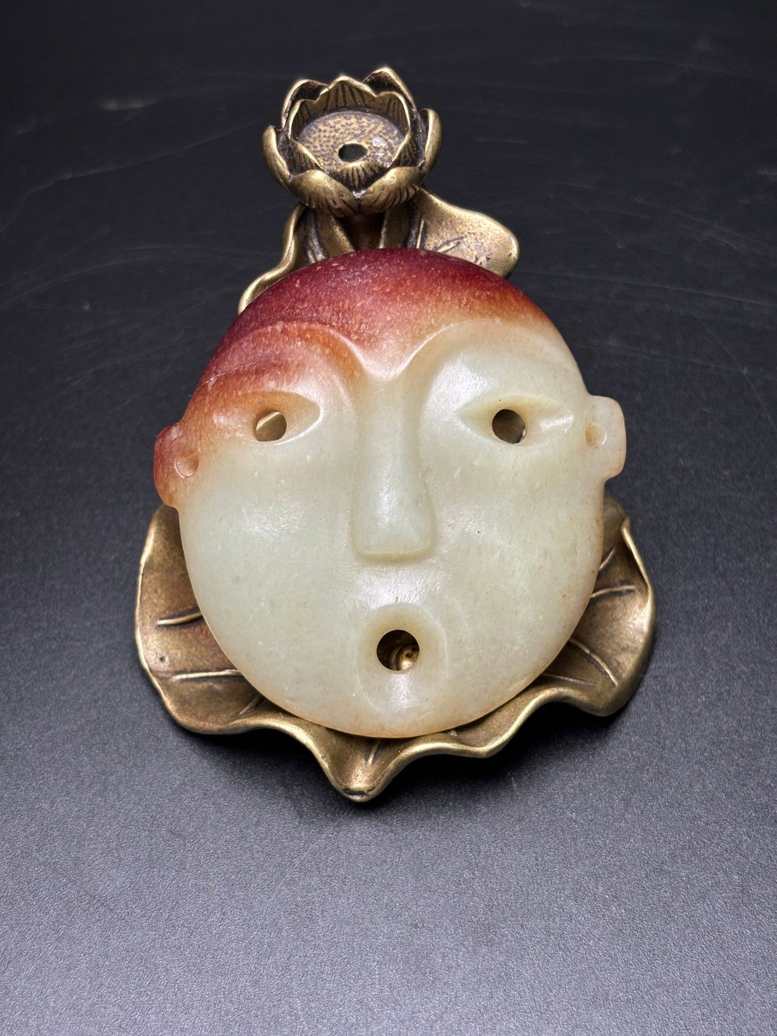 An Exquisite White Jade Mask: An Exquisite White Jade Mask,Qing Dynasty,China,Size:2.4inx2.3inx0.6in,Weight:42g 白玉面具,中国清代