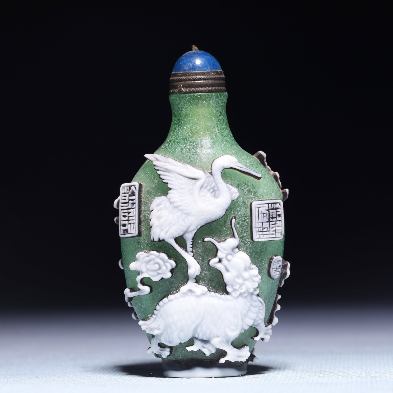An Exquisite Glass Kylin Crane Pattern Snuff Bottle: An Exquisite Glass Kylin Crane Pattern Snuff Bottle,Qing Dynasty,China,Qianlong Four-character Mark,Size:1.6inx1.2inx3.1in,Weight:61.9g 琉璃麒麟鹤纹鼻烟