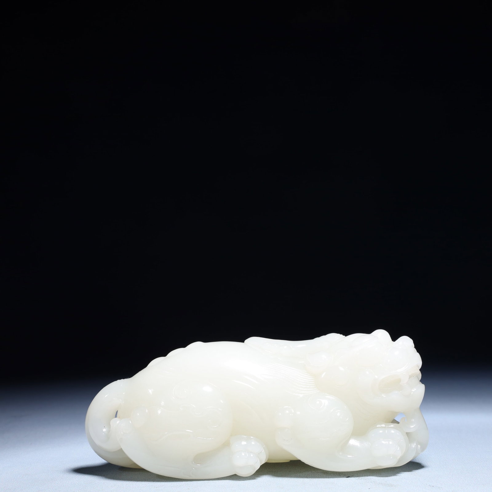 An Exquisite White Jade Wealth-Attracting Creature Ornament: An Exquisite White Jade Wealth-Attracting Creature Ornament,Qing Dynasty,China,Size:6.3inx2.8inx2.4in,Weight:1136.9g 白玉貔貅摆件,中国清代