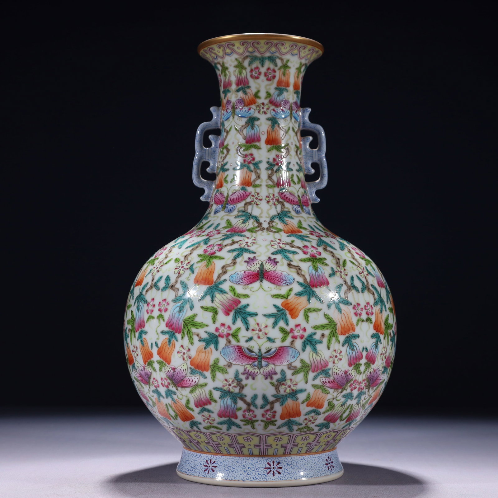 An Exquisite Famille-Rose Painted Gold Flower and Butterfly Pattern Double-Ears Vase: An Exquisite Famille-Rose Painted Gold Flower and Butterfly Pattern Double-Ears Vase,Qing Dynasty,China,Qianlong Six-character Mark,Size:6.7inx12.2in,Weight:1950g 粉彩描金Ŏ