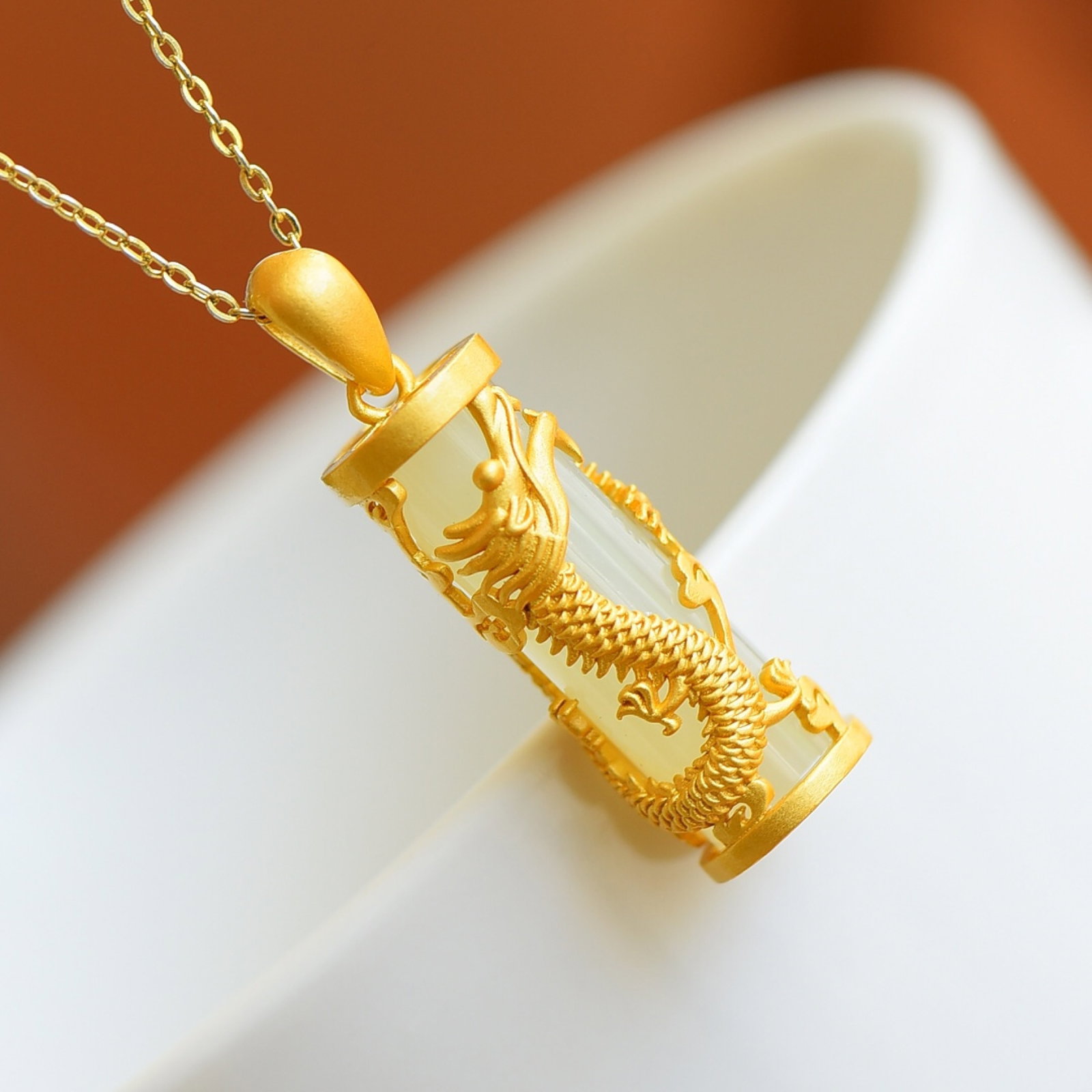An Exquisite Sterling Silver-Gold Plated Inlaid White Jade Pendant: An Exquisite Sterling Silver-Gold Plated Inlaid White Jade Pendant , Size :0.3inx0.9in 纯银镀金镶白玉吊坠,尺寸:0.3inx0.9in