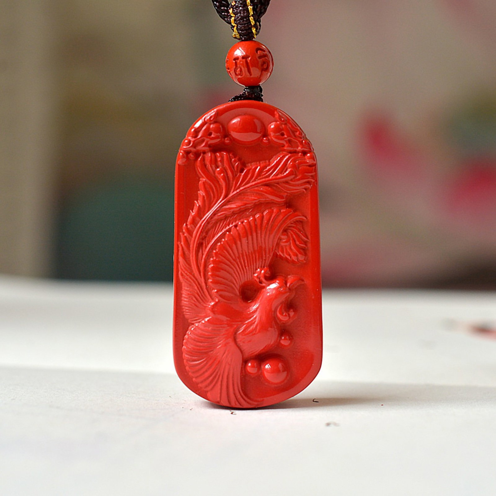 An Exquisite Cinnabar Dragon and Phoenix Pattern Pendant (1 of 5)
