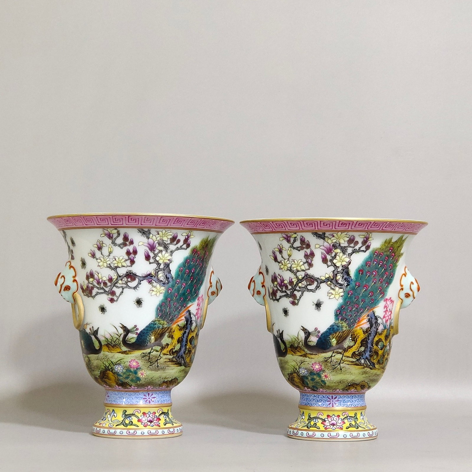 A Pair of Exquisite Famille-Rose Painted Gold Flower and Peacock Pattern Beast-Ears Stem Cups,With: A Pair of Exquisite Famille-Rose Painted Gold Flower and Peacock Pattern Beast-Ears Stem Cups,With Poem,Qing Dynasty,China,Qianlong Six-character Mark,Size:4.6inx4.1in 一对粉彩