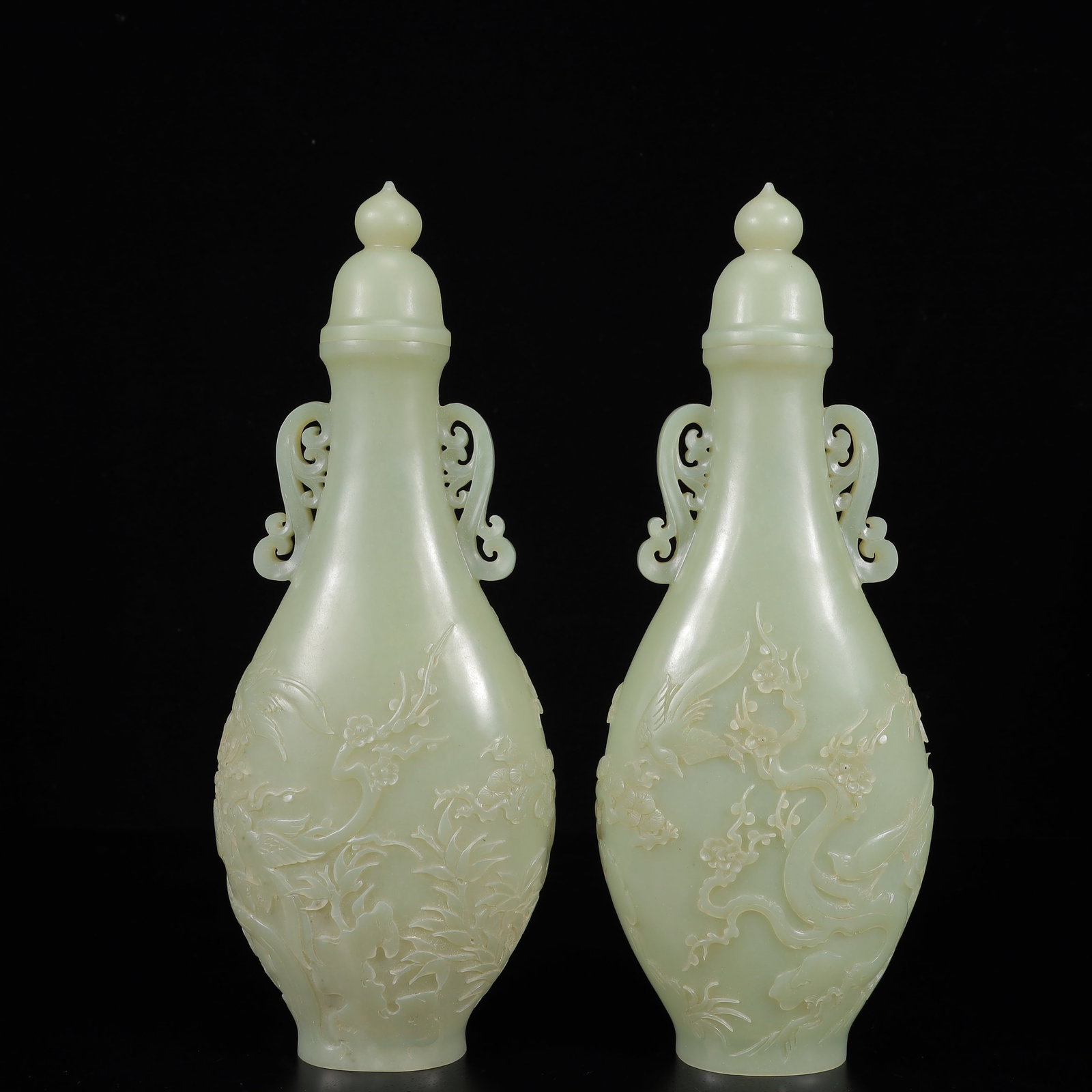 A Pair of Exquisite White Jade Flower Pattern Double-Ears Vases: A Pair of Exquisite White Jade Flower Pattern Double-Ears Vases,Qing Dynasty,China,Size:3.9inx2inx10.2in,Weight:650g 一对白玉花卉纹双耳瓶,&#