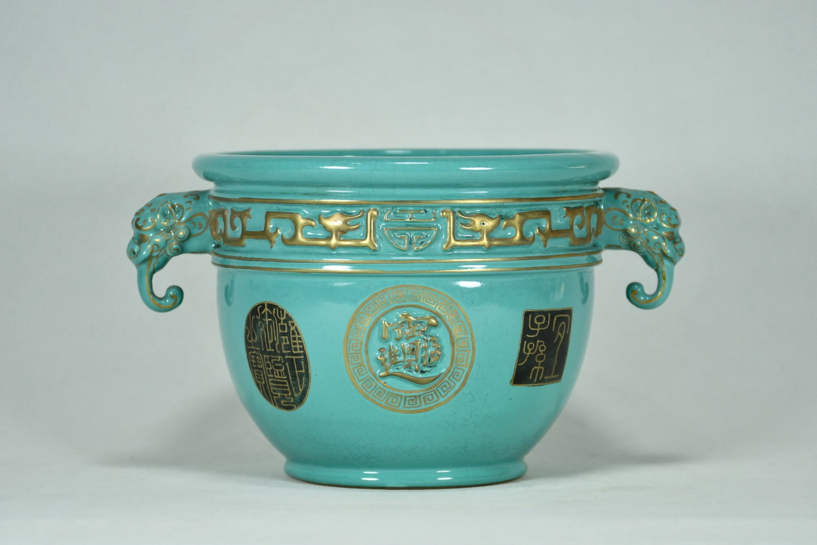 An Exquisite Guan yao Turquoise Glazed Painted Gold Dragon Pattern Beast-Ears Vat: An Exquisite Guan yao Turquoise Glazed Painted Gold Dragon Pattern Beast-Ears Vat,Qing Dynasty,China,Yongzheng Four-character Mark,Size:4.7inx7.5in 官窑松石绿釉