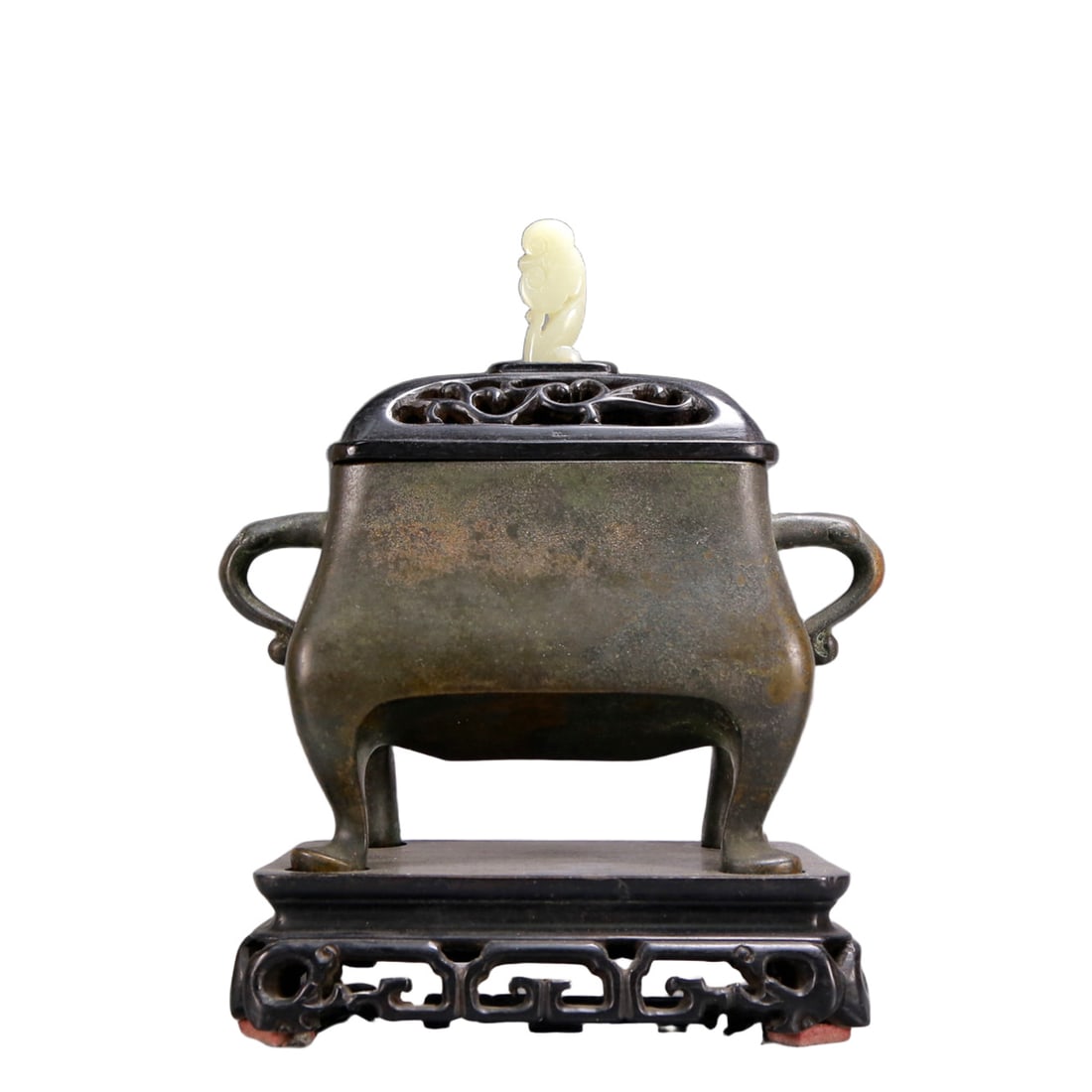 An Archaic Bronze Double-Ears and four legs Censer,with Zitanwood Inlaid White Jade Cover: An Archaic Bronze Double-Ears and four legs Censer,with Zitanwood Inlaid White Jade Cover,Ming Dynasty, China,Xuande Six-character Mark,Size:7.3inx3inx8.3in,Weight:2650g 铜双耳ࢯ
