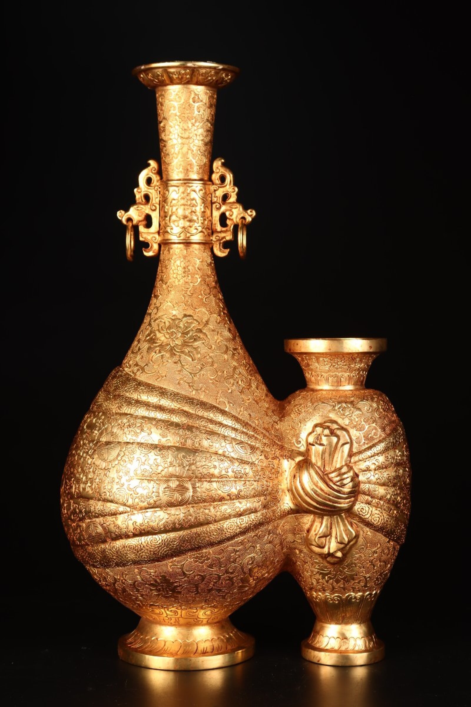 A Rare Gilt Bronze Lotus Pattern Double-Ears Conjoined bottles: A Rare Gilt Bronze Lotus Pattern Double-Ears Conjoined bottles,Qing Dynasty,China,Qianlong Four-character Mark,Size:9.1inx15inx6.3in,Weight:2327g 铜鎏金缠枝莲ಬ
