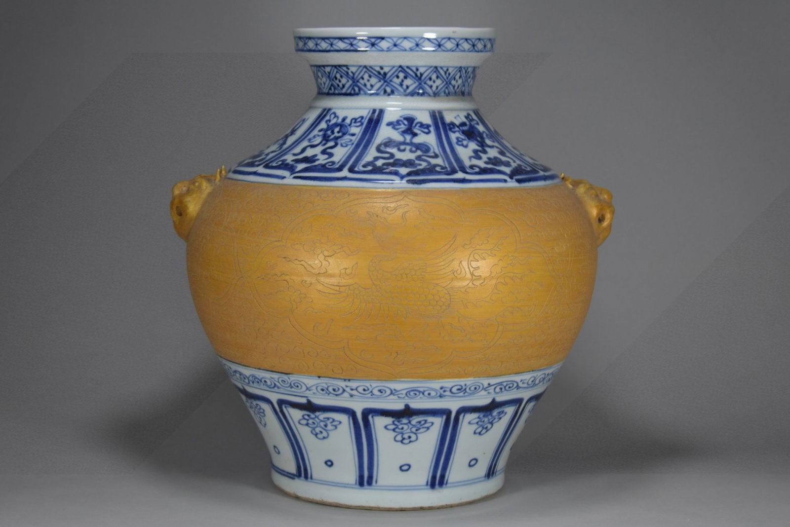 A Rare Blue and White Gold Glazed Auspicious Cloud and Phoenix Pattern Beast-Ears Jar: A Rare Blue and White Gold Glazed Auspicious Cloud and Phoenix Pattern Beast-Ears Jar,Yuan Dynasty,China,Size:14.6inx13.8in 青花金釉祥云凤纹兽 