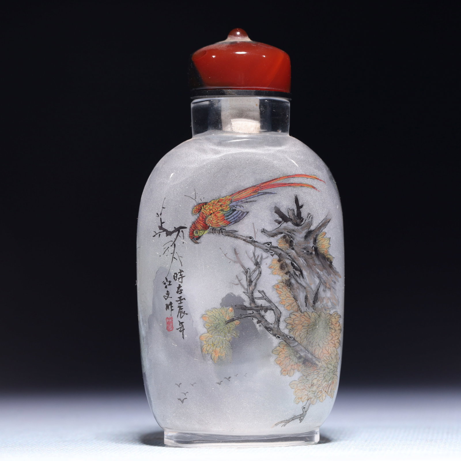 An Exquisite Glass Flower and Bird Pattern Snuff Bottle: An Exquisite Glass Flower and Bird Pattern Snuff Bottle,Qing Dynasty,China,Size:1.8inx1inx3.5in,Weight:59.6g 琉璃花鸟纹鼻烟壶,中国清&#