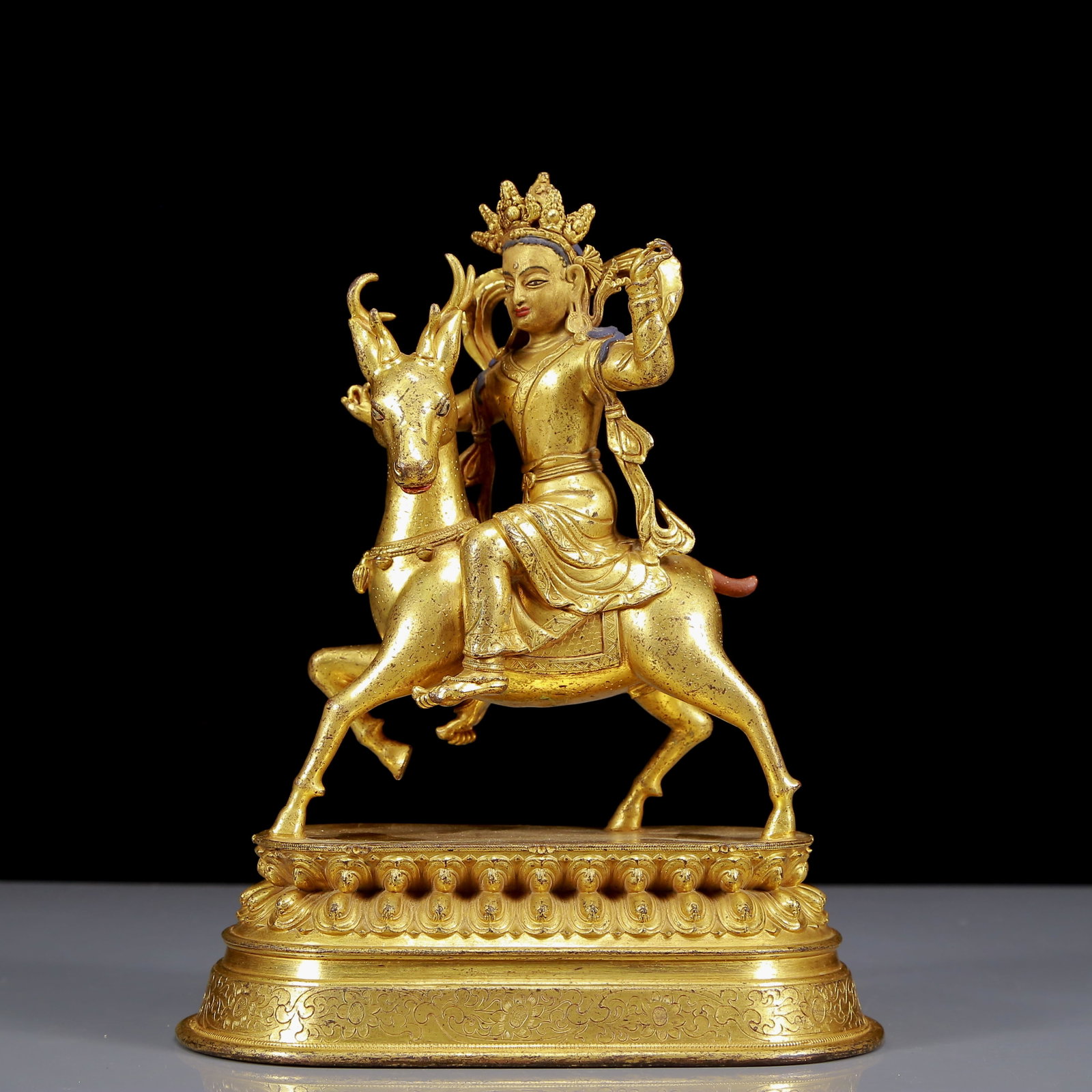 A Solemn Gilt Bronze Riding Deer Buddha Statue: A Solemn Gilt Bronze Riding Deer Buddha Statue,Ming Dynasty, China,Size:7.7inx4.5inx9.8in,Weight:1925g 铜鎏金骑鹿佛像，明代