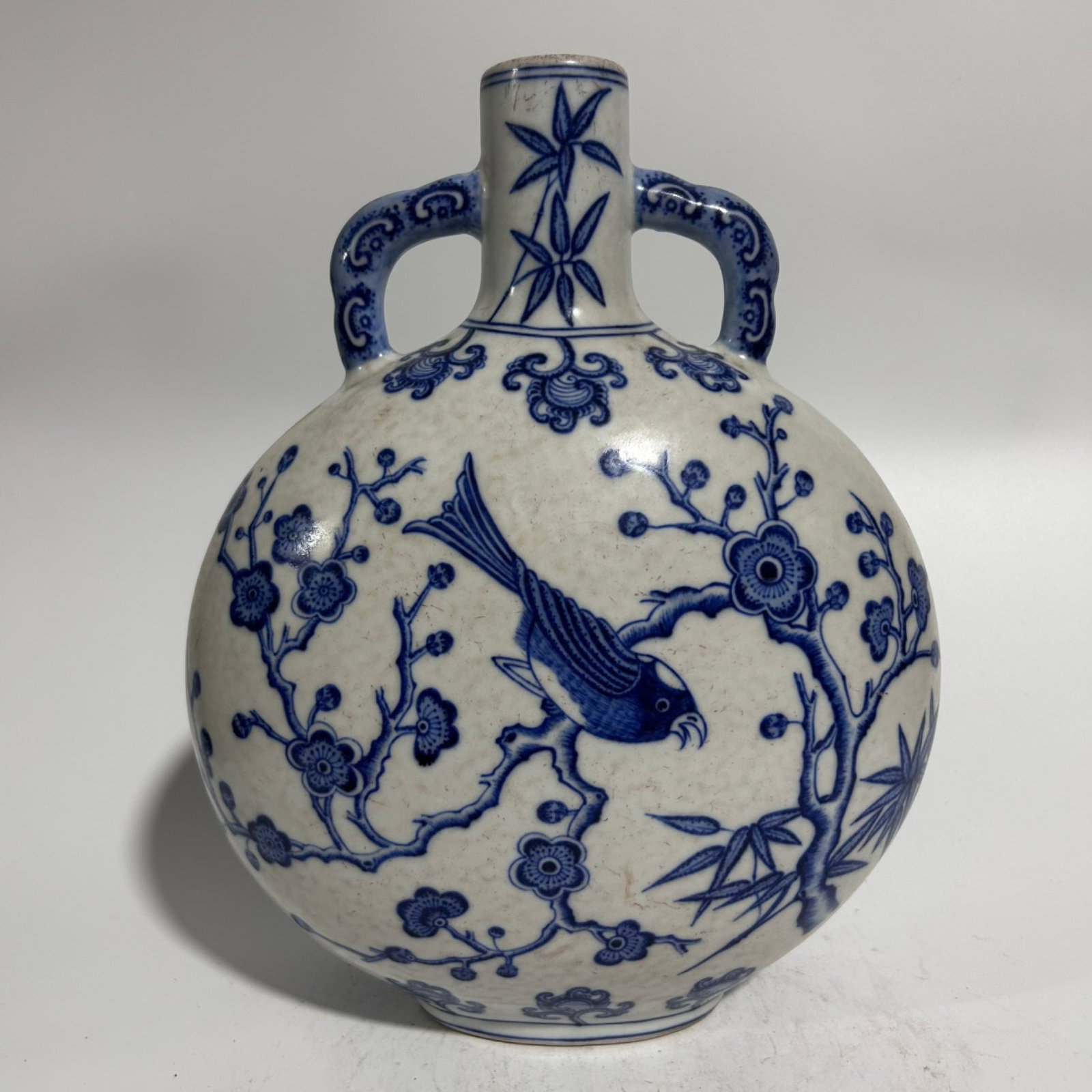 An Exquisite Blue and White Flower and Bird Pattern Double-Ears Vase: An Exquisite Blue and White Flower and Bird Pattern Double-Ears Vase,Qing Dynasty,China,Yongzheng Six-character Mark,Size:7.7inx11.4in 青花花鸟纹双耳瓶,