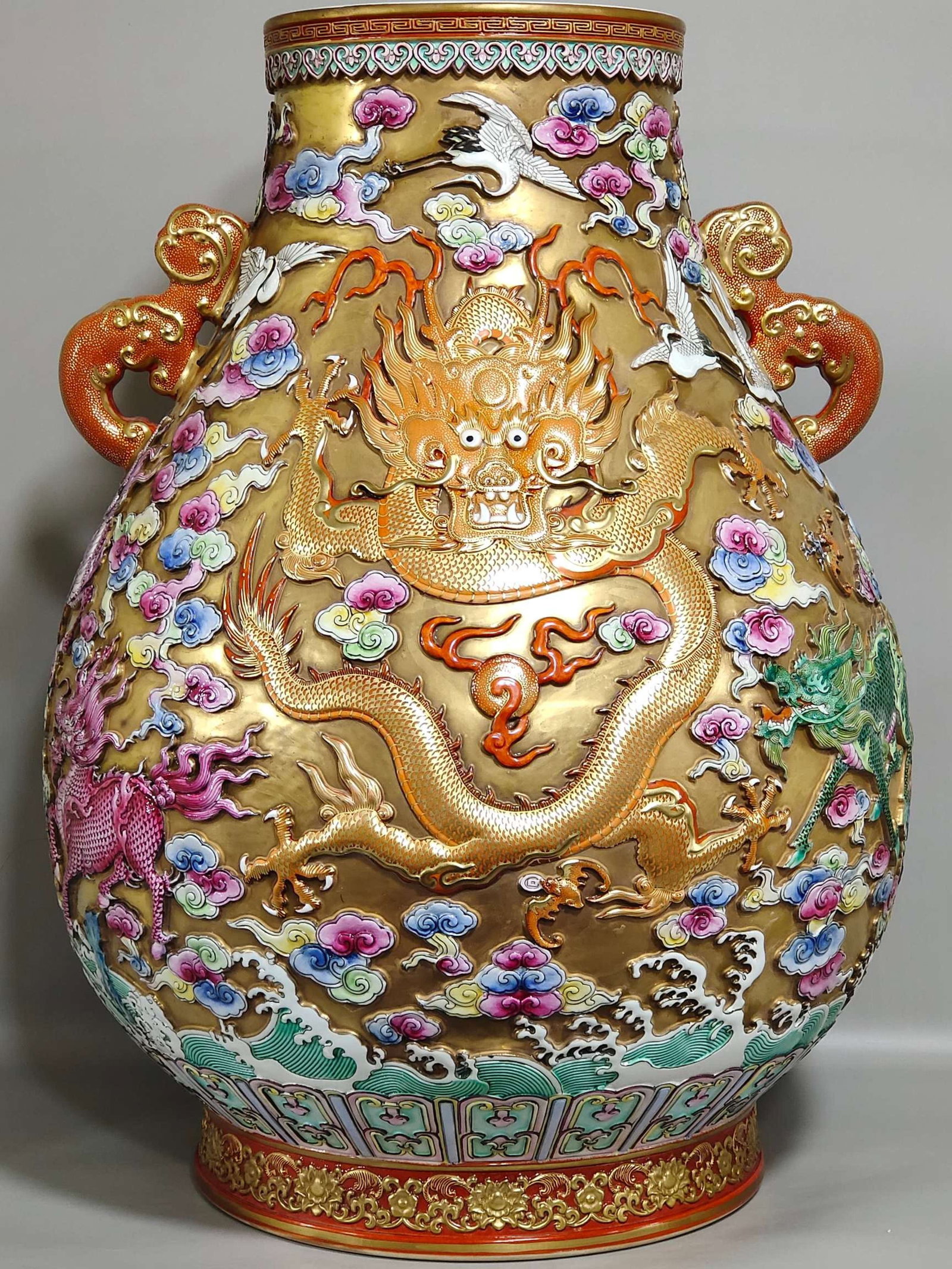 A Huge Gold Ground Famille-Rose Kylin Auspicious Cloud and Dragon Pattern Double-Ears Vase: A Huge Gold Ground Famille-Rose Kylin Auspicious Cloud and Dragon Pattern Double-Ears Vase,Qing Dynasty,China,Qianlong Six-character Mark,Size:19.7inx13.4in 金地粉彩麒