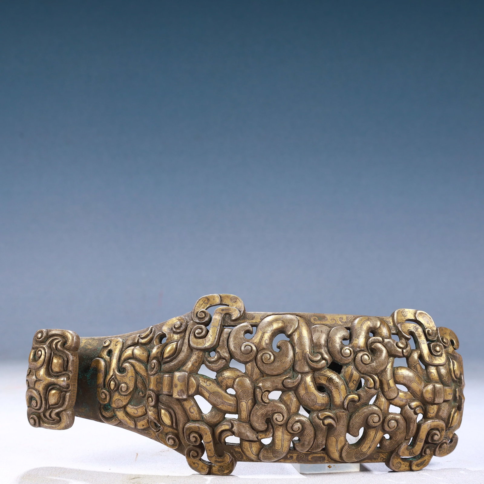 An Exquisite Bronze Inlaid Gold and Silver Auspicious Beast Pattern Hook: An Exquisite Bronze Inlaid Gold and Silver Auspicious Beast Pattern Hook,Qing Dynasty, China,Size:3.5inx8.7inx2in,Weight:600g 铜错金银瑞兽纹带钩,&