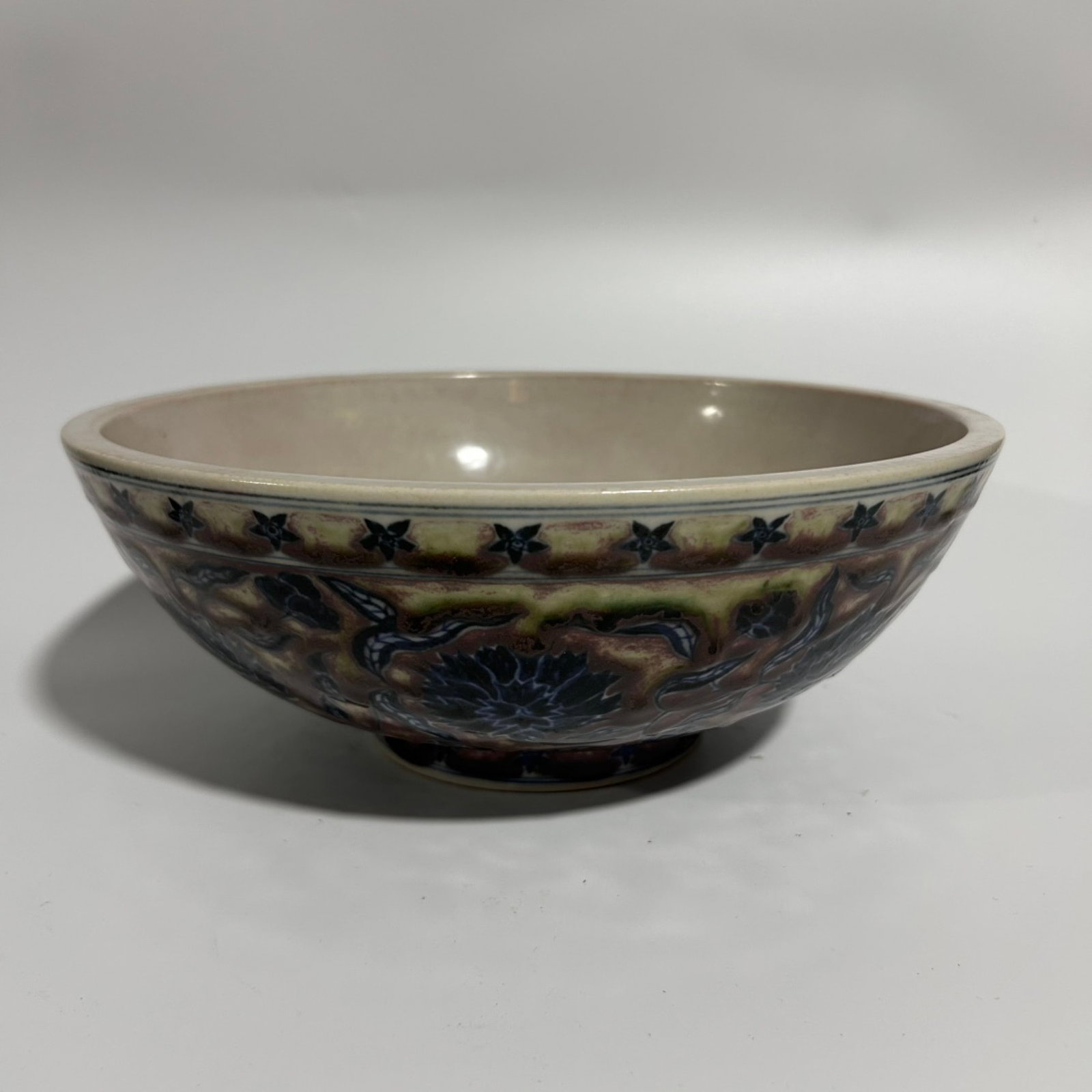 An Exquisite Blue and White Underglaze-Red Lotus Pattern Bowl: An Exquisite Blue and White Underglaze-Red Lotus Pattern Bowl,Qing Dynasty,China,Size:4.5inx11in 青花釉里红缠枝莲纹碗,中国଀