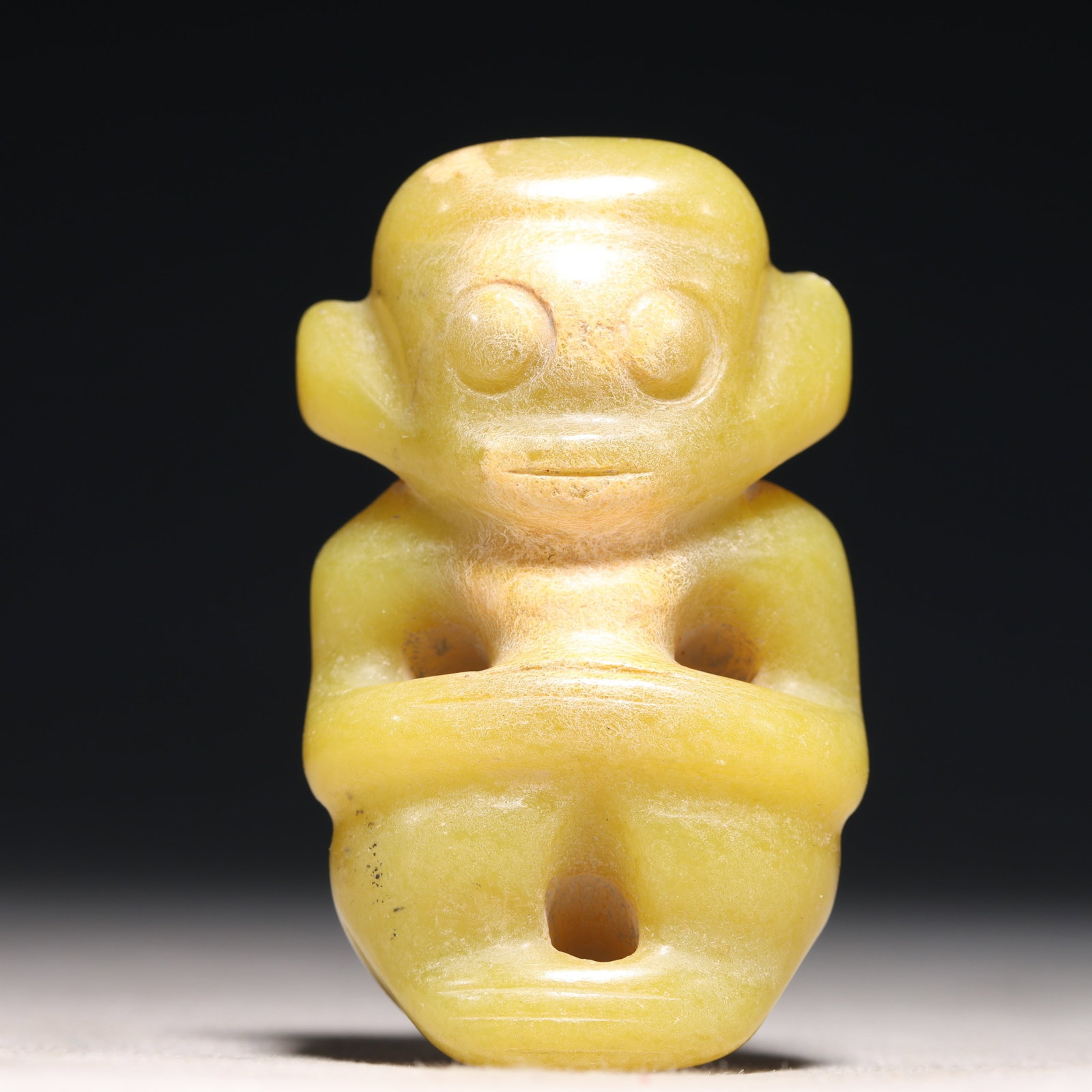 An Archaic Hongshan Culture Yellow Jade Figure Ornament: An Archaic Hongshan Culture Yellow Jade Figure Ornament,Ancient Time, China,Size:1.6inx0.7inx2.4in Weight:69.3g 红山文化黄玉人物摆件,新