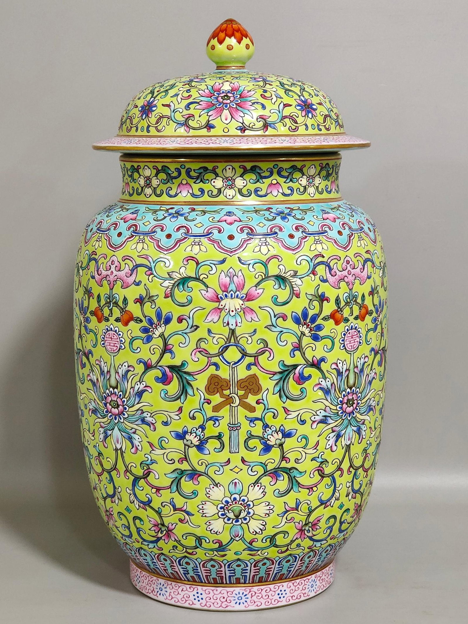 An Exquisite Yellow Ground Famille-Rose Painted Gold Lotus Pattern Cover Jar: An Exquisite Yellow Ground Famille-Rose Painted Gold Lotus Pattern Cover Jar,Qing Dynasty,China,Jiaqing Six-character Mark,Size:11.4inx5.9in 黄地粉彩描金缠