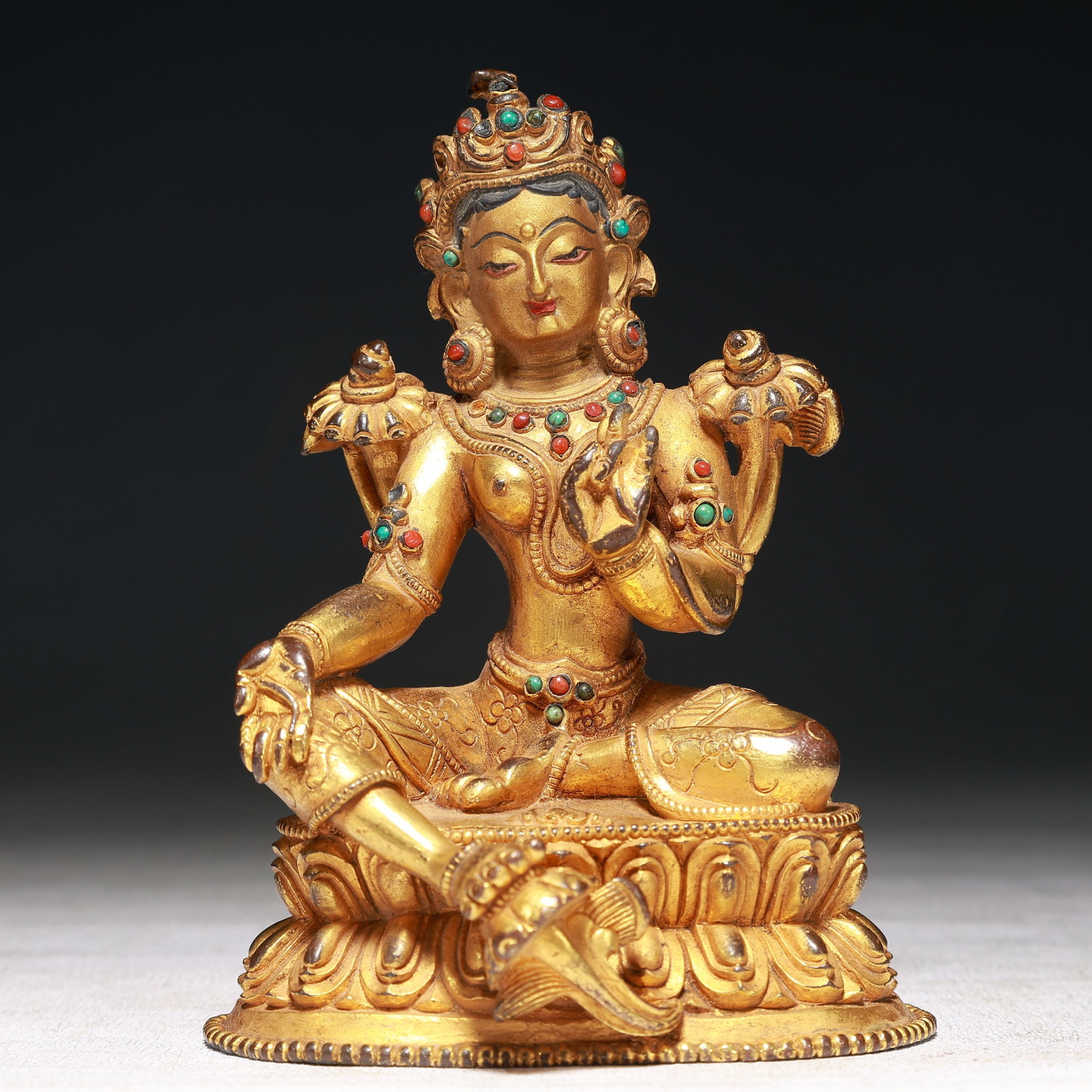 A Solemn Gilt Bronze Statue of Tara,Inlaid Turquoise: A Solemn Gilt Bronze Statue of Tara,Inlaid Turquoise,Qing Dynasty,China,Size:3.5inx2.8inx4.7in,Weight:500g