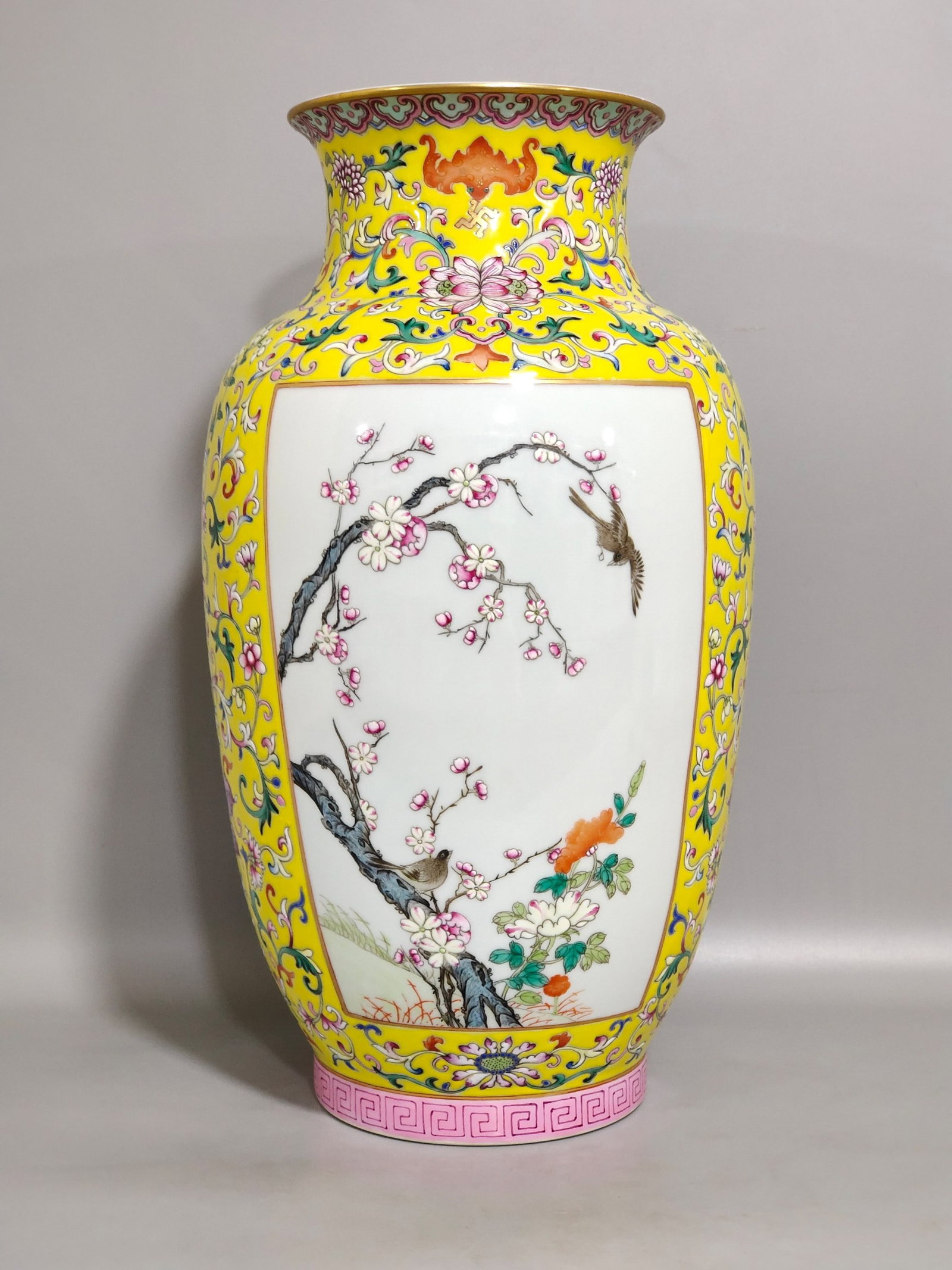 A Rare Famille-Rose Yellow Ground Painted Gold Flower and Bird Pattern Vase: A Rare Famille-Rose Yellow Ground Painted Gold Flower and Bird Pattern Vase,Qing Dynasty,China,Qianlong Six-character Mark,Size:11.8inx6.5in 粉彩黄地描金花