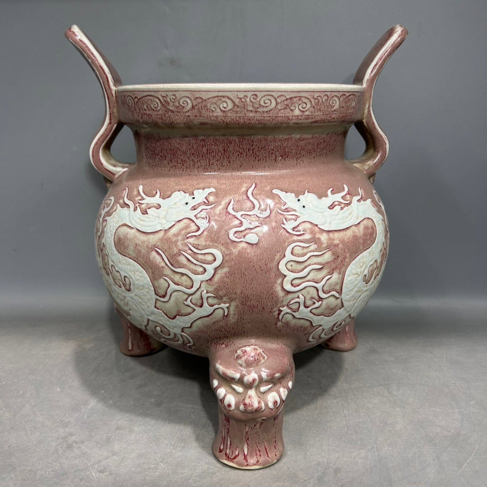 A Rare Underglaze-Red Auspicious Cloud and Dragon Pattern Double-Ears Tripod Censer: A Rare Underglaze-Red Auspicious Cloud and Dragon Pattern Double-Ears Tripod Censer,Qing Dynasty,China,Size:9.4inx13.6in