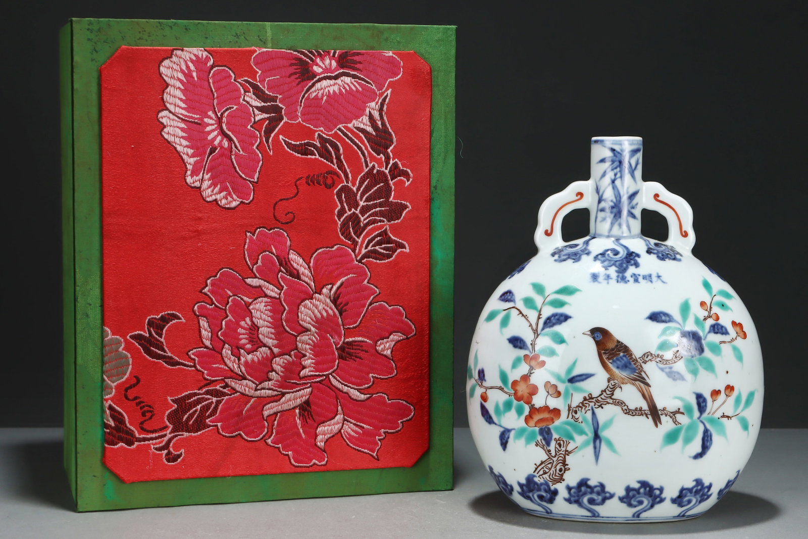An Exquisite Blue and White Wucai Flower and Bird Pattern Double-Ears Vase: An Exquisite Blue and White Wucai Flower and Bird Pattern Double-Ears Vase,Ming Dynasty,China,Xuande Six-character Mark,Size:10.7inx8.5in 青花五彩花鸟纹ࡡ