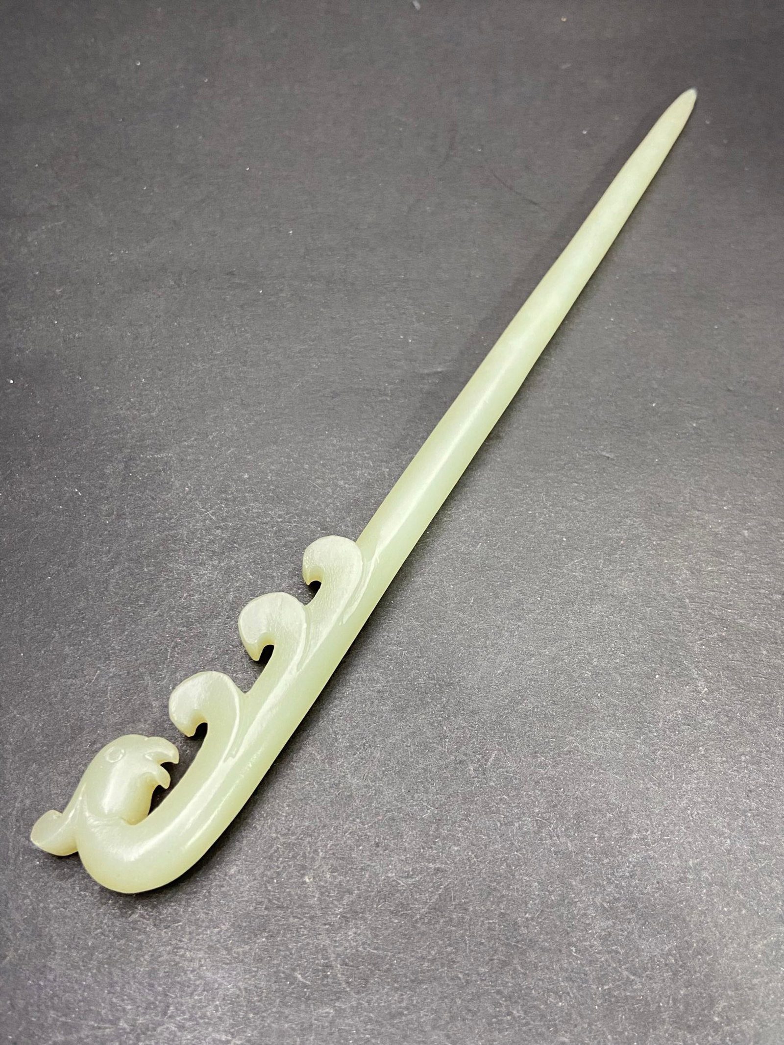 An Exquisite White Jade Phoenix-head Hairpin: An Exquisite White Jade Phoenix-head Hairpin,Qing Dynasty,China,Size:193mmx22.3mmx9.8mm,Weight:36g 白玉凤首发簪,中国清代