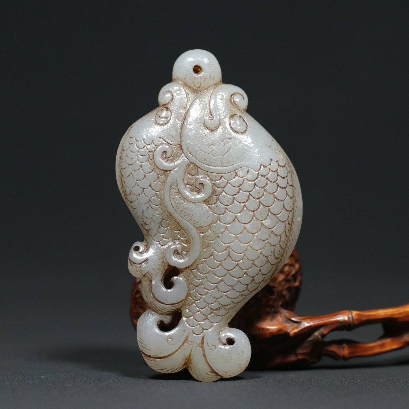 An Exquisite White Jade Fish Pendant: An Exquisite White Jade Fish Pendant,Qing Dynasty,China,Size:3.5inx2inx0.6in,Weight:84.5g 白玉鱼挂件,中国清代