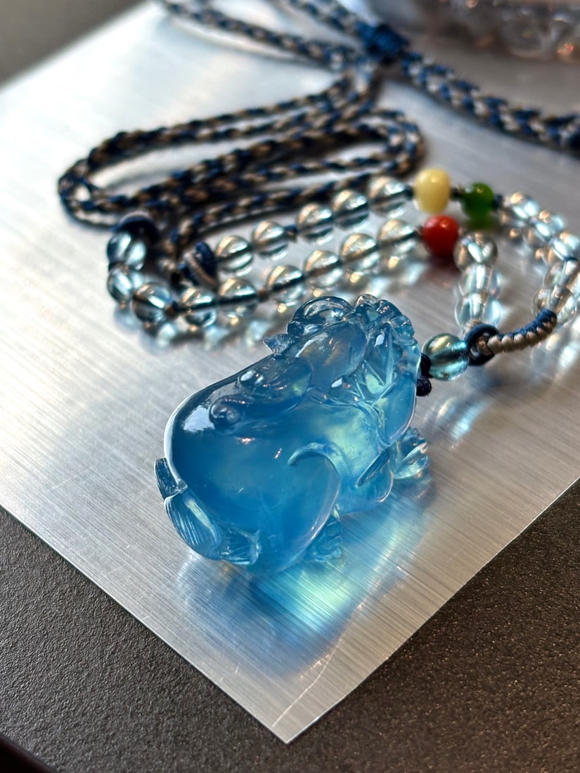 An Exquisite Aquamarine Auspicious Beast Pendant: An Exquisite Aquamarine Auspicious Beast Pendant,Size:28mmx18mmx19mm,Total Weight:18g 海蓝宝瑞兽吊坠
