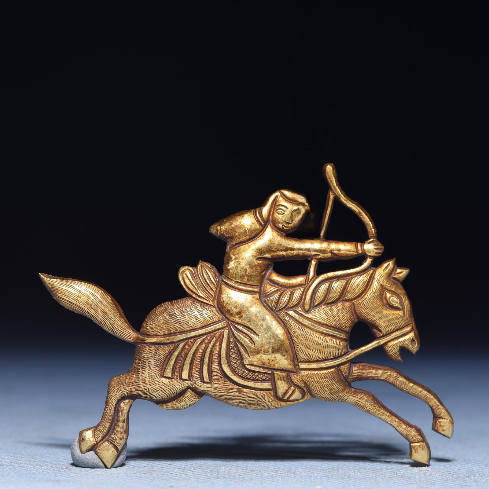 An Exquisite Gilt Silver Figure Riding Horse Ornament: An Exquisite Gilt Silver Figure Riding Horse Ornament,Qing Dynasty,China,Size:2.8inx2.2in,Weight:20.6g
