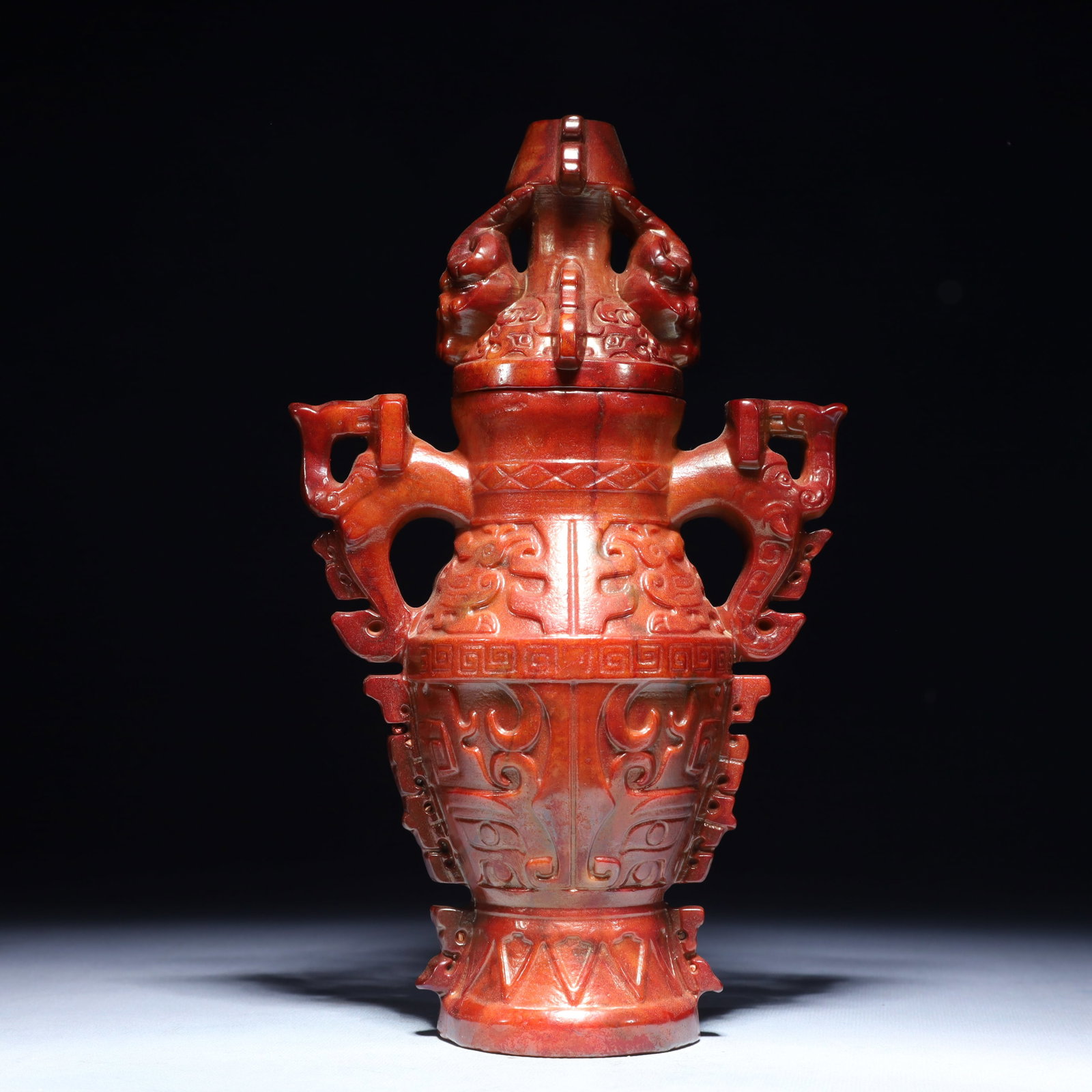 An Exquisite Archaic Jade Beast-Face Pattern Double-Ears Bottle: An Exquisite Archaic Jade Beast-Face Pattern Double-Ears Bottle,Ancient Time,China,Size:6.3inx3.1inx10.2in,Weight:1900g 高古玉兽面纹双耳盖瓶