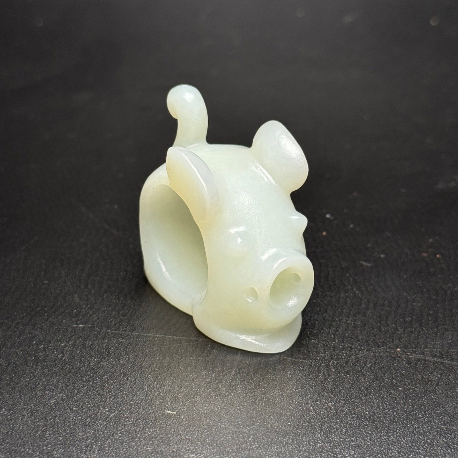 An Exquisite White Jade Pig-Shaped Fingerstall: An Exquisite White Jade Pig-Shaped Fingerstall,Qing Dynasty,China,Size:39mmx22mmx41mm,Weight:37g 白玉猪形扳指,中国清代