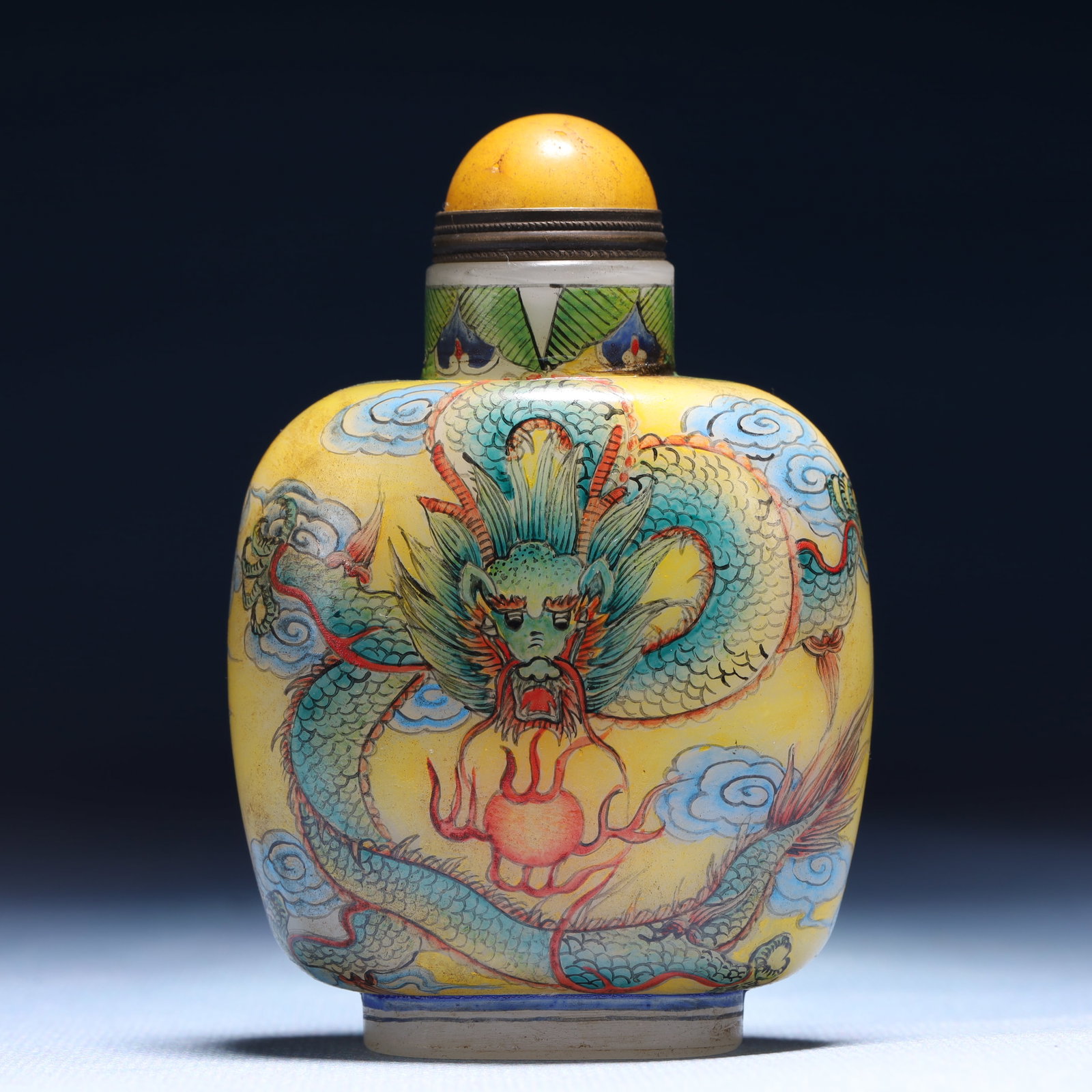 An Exquisite Glass Auspicious Cloud and Dragon Pattern Snuff Bottle: An Exquisite Glass Auspicious Cloud and Dragon Pattern Snuff Bottle,Qing Dynasty,China,Qianlong Four-character Mark,Size:2.4inx1.2inx3.5in,Weight:104g