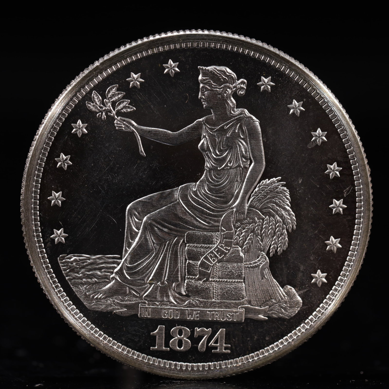 USA Trade Dollar 1874 Coin: American coin. Obverse: Liberty seated on a pedestal facing the sea to the left holding olive branches surrounded by 13 stars. IN GOD WE TRUST / LIBERTY / 1874. Reverse: An eagle holding branches with