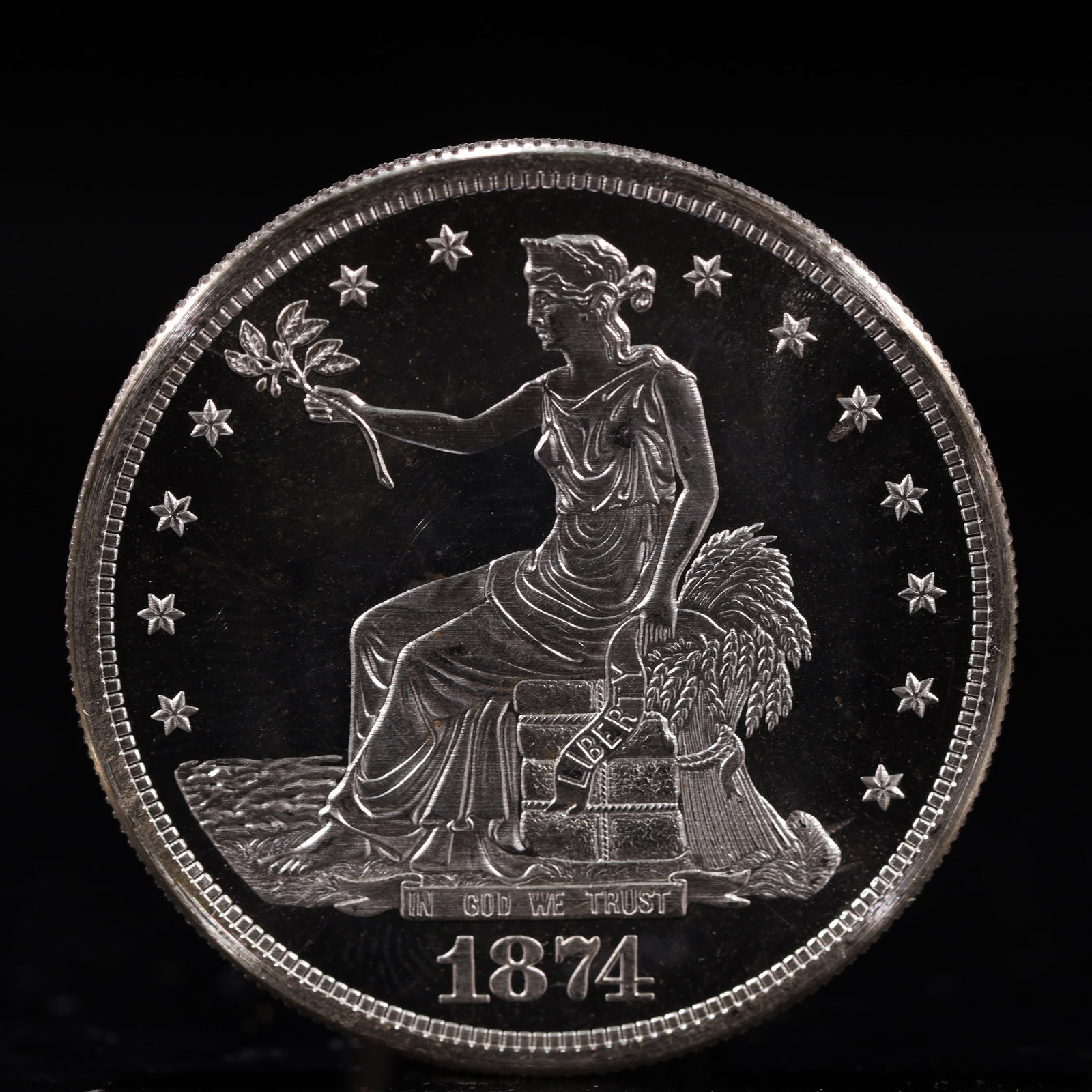 USA Trade Dollar 1874 Coin: American coin. Obverse: Liberty seated on a pedestal facing the sea to the left holding olive branches surrounded by 13 stars. IN GOD WE TRUST / LIBERTY / 1874. Reverse: An eagle holding branches with