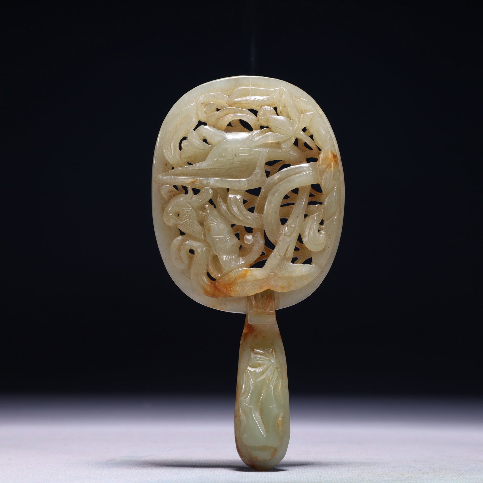 An Exquisite White Jade Flower and Phoenix Pattern Buckle: An Exquisite White Jade Flower and Phoenix Pattern Buckle,Qing Dynasty,China,Size:2.8inx5.5in,Weight:116.4g 白玉花卉凤纹腰带扣,中国