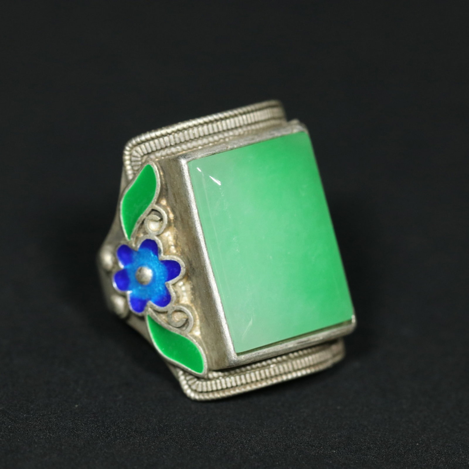 An Exquisite Silver Inlaid Jadeite Blueing Ring: An Exquisite Silver Inlaid Jadeite Blueing Ring,Qing Dynasty,China,Size:1.1inx1.1inx1in,Weight:23.5g 银镶翡翠烧蓝戒指,中国清代