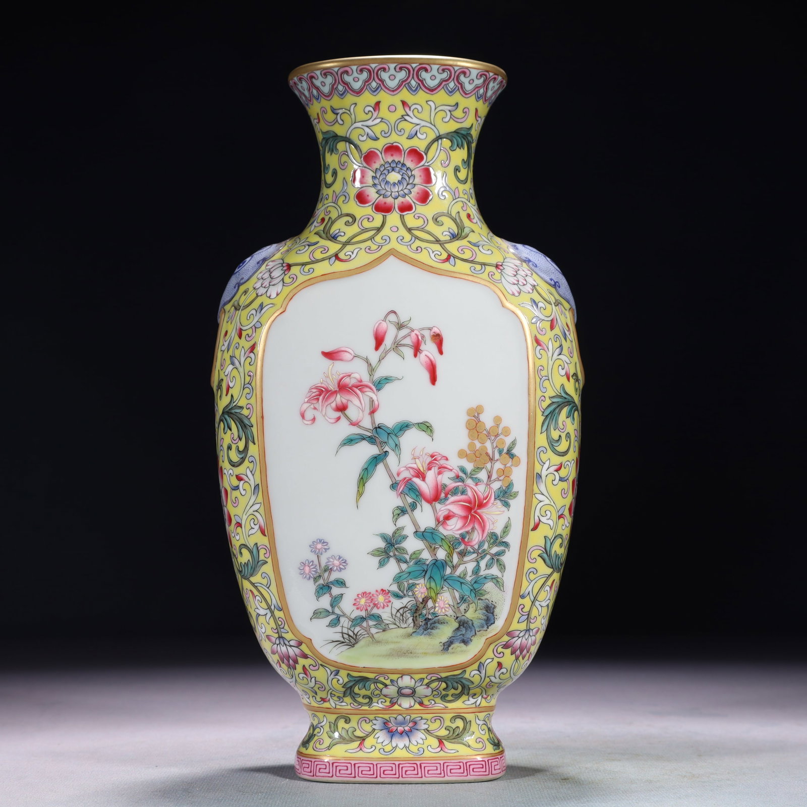 An Exquisite Yellow Ground Famille-Rose Flower Pattern Beast-Ears Vase: An Exquisite Yellow Ground Famille-Rose Flower Pattern Beast-Ears Vase,Qing Dynasty,China,Qianlong Six-character Mark,Size:4.7inx2.8inx10in,Weight:1200g