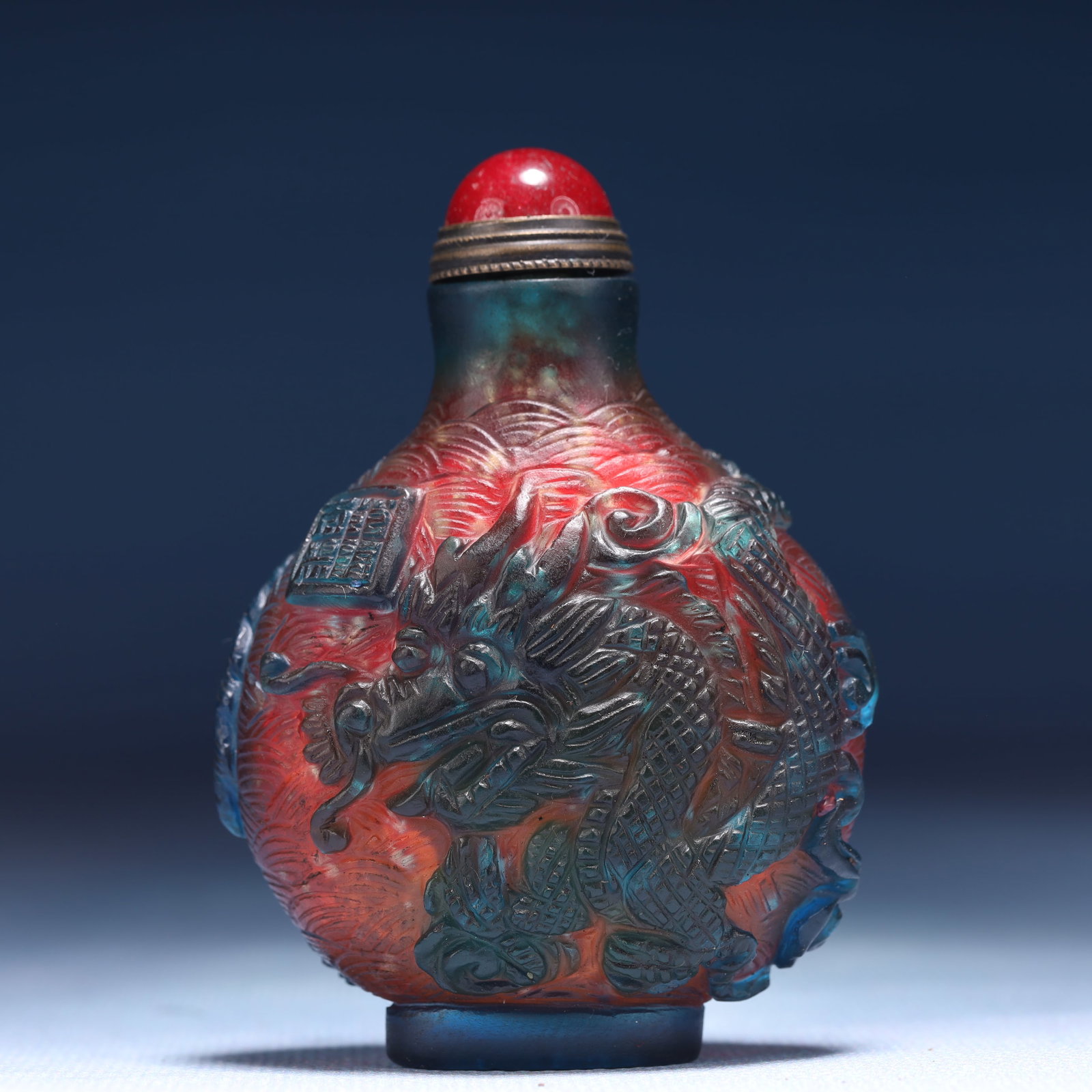 An Exquisite Glass Dragon and Phoenix Pattern Snuff Bottle: An Exquisite Glass Dragon and Phoenix Pattern Snuff Bottle,Qing Dynasty,China,Qianlong Four-character Mark,Size:2.4inx1.2inx2.8in,Weight:62g 琉璃龙凤纹鼻烟