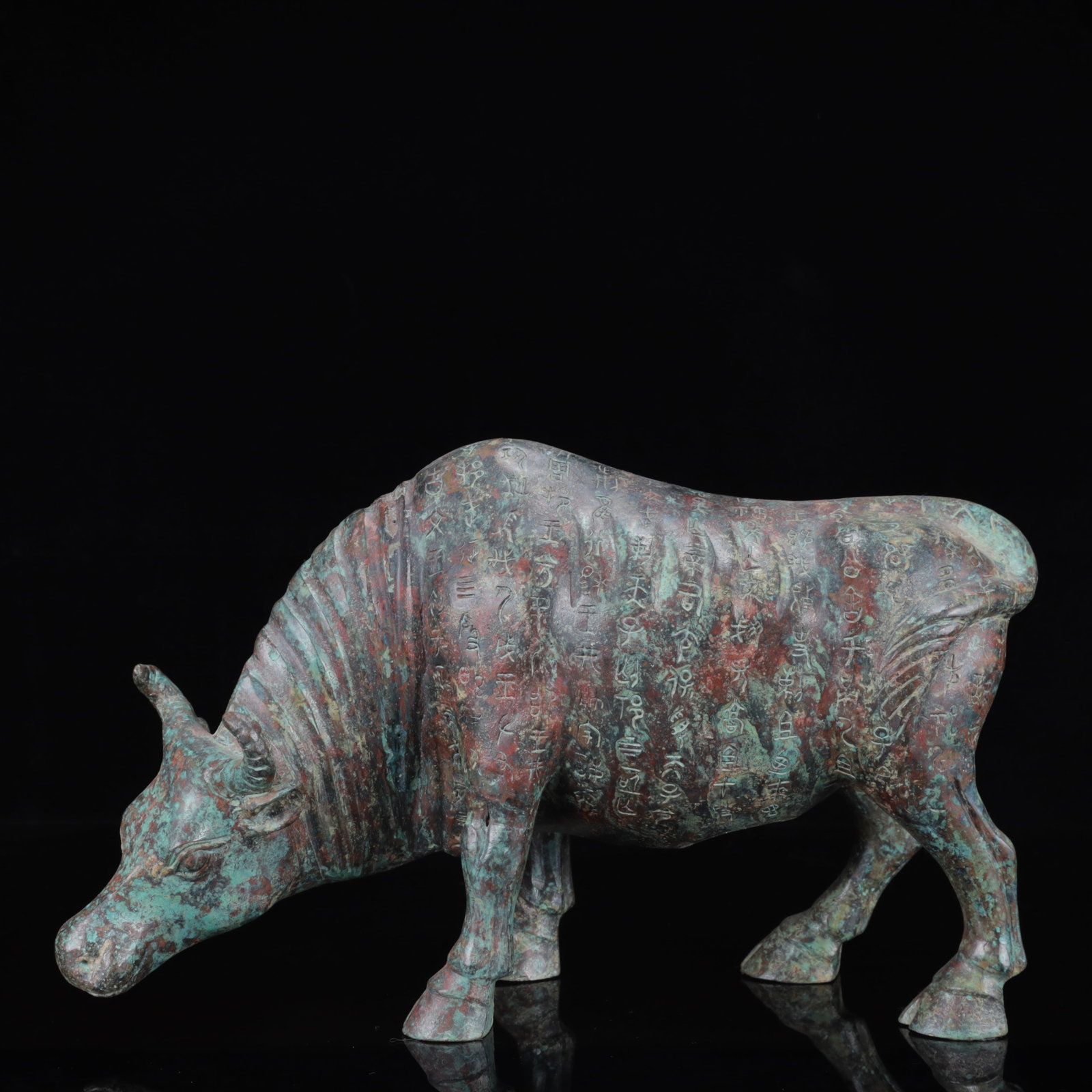 An Archaic Bronze Inscription Buffalo Ornament: An Archaic Bronze Inscription Buffalo Ornament,the Warring States Period in China,Size:13inx4.3inx8.7in,Weight:2800g 青铜铭文牛摆件,中国战&#