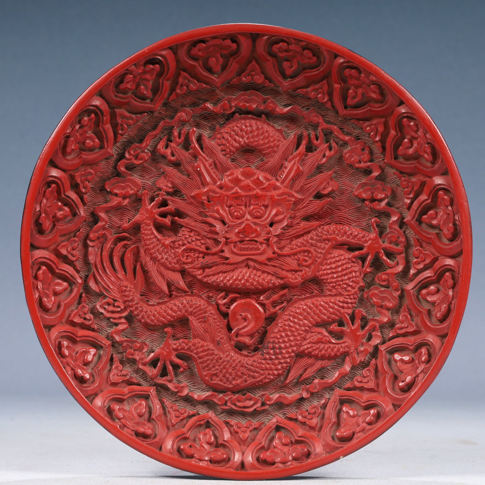 An Exquisite Carved Red Lacquer Auspicious Cloud and Dragon Pattern Plate (1 of 5)
