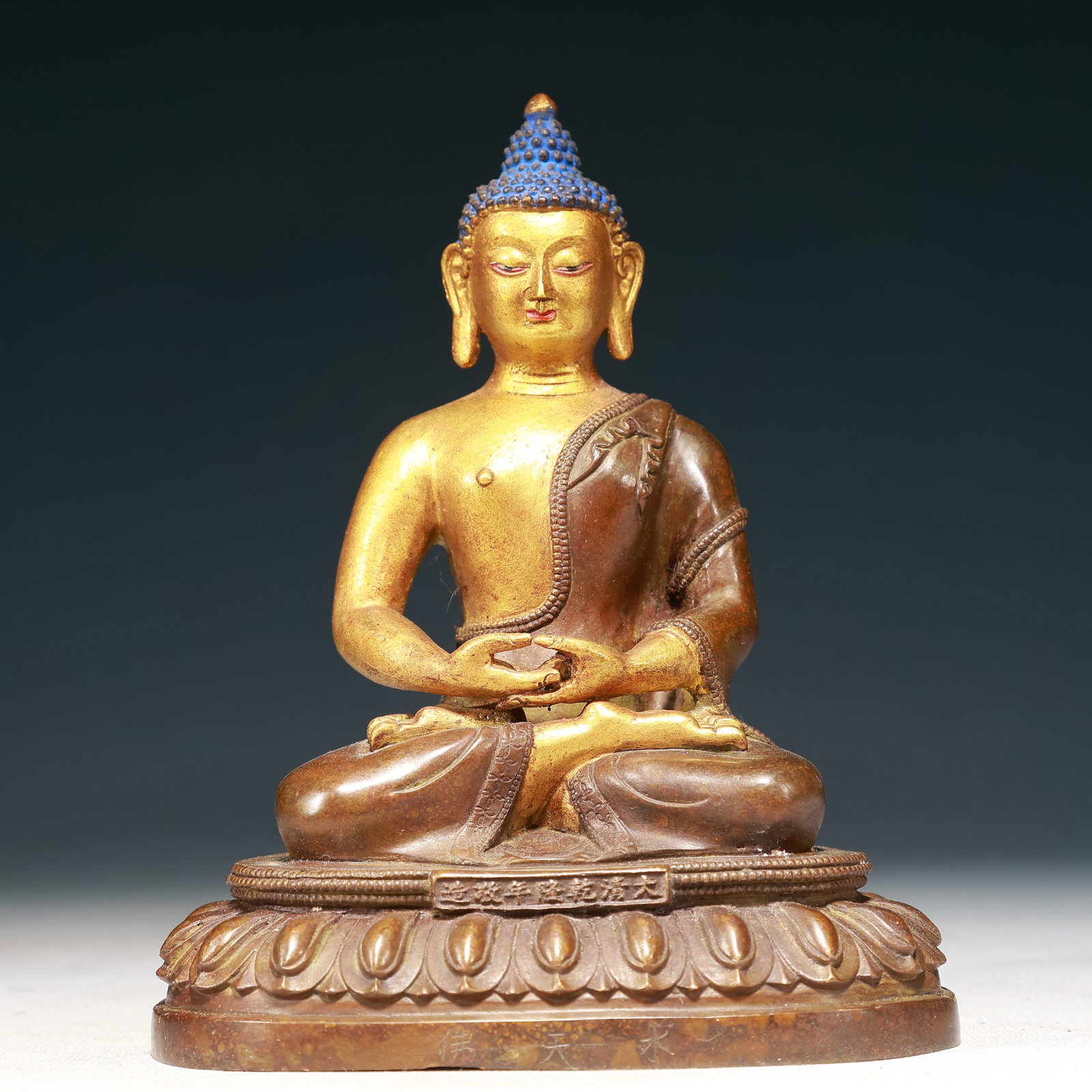 A Solemn Gilt Bronze Statue of Sakyamuni: A Solemn Gilt Bronze Statue of Sakyamuni,Qing Dynasty,China,Qianlong Mark,Size:5.3inx3.5inx6.7in,Weight:1100g 铜鎏金释迦摩尼像,中国清&