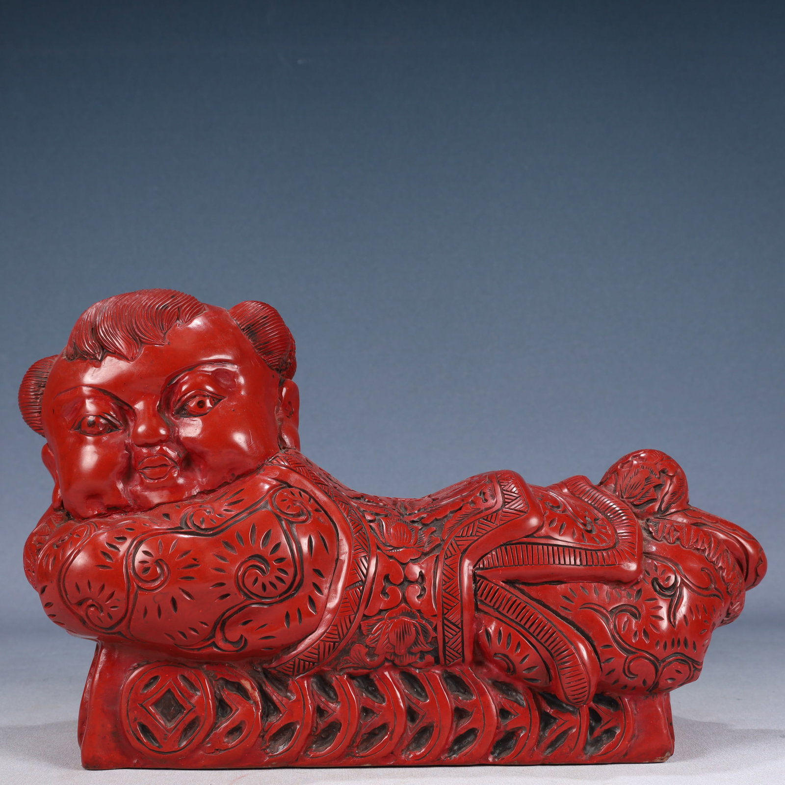 A Rare Carved Red Lacquer Figure-Shaped Pillow: A Rare Carved Red Lacquer Figure-Shaped Pillow,Qing Dynasty, China,Size:13.8inx5.9inx8.3in,Weight:4100g