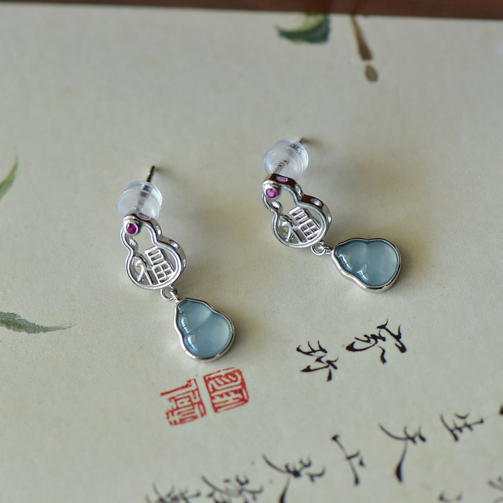 A Pair of Exquisite Sterling Silver Inlaid Jadeite Earrings: A Pair of Exquisite Sterling Silver Inlaid Jadeite Earrings,Size:6mmx8mm 一对纯银镶翡翠耳钉